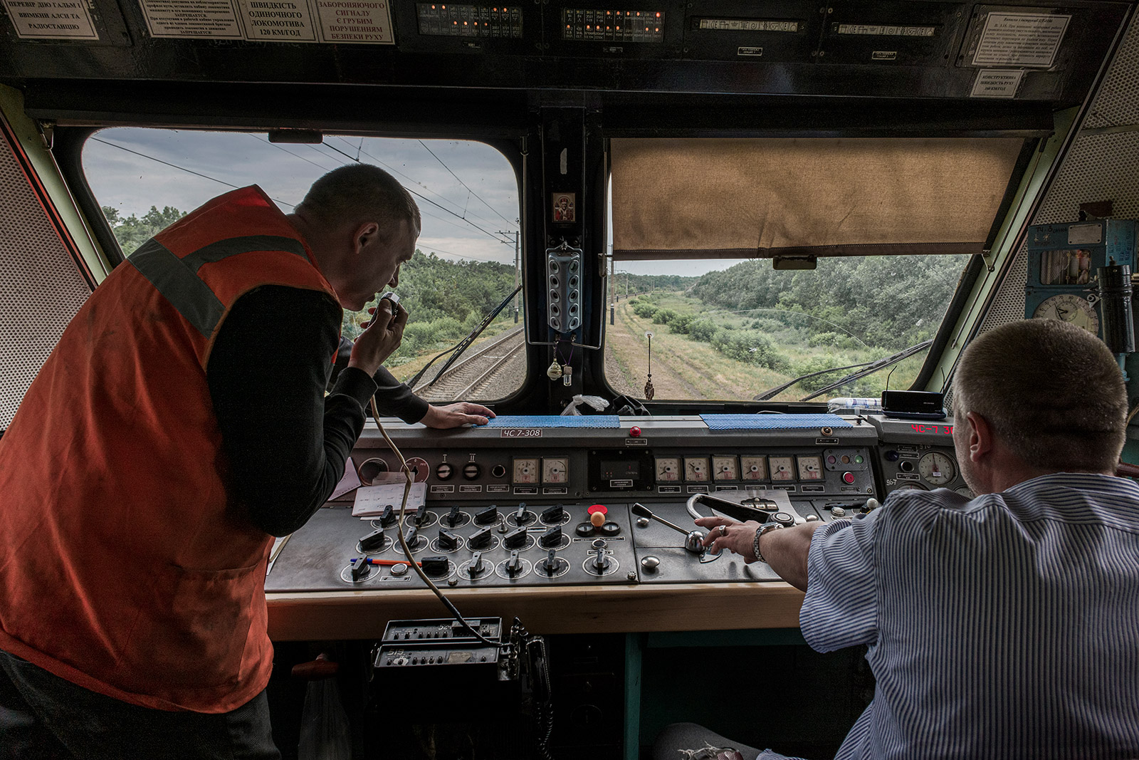 Dmitrii Prishedko and Victor Bondar operate an evacuation train heading from Pokrovsk, Ukraine, to Lviv, Ukraine. 