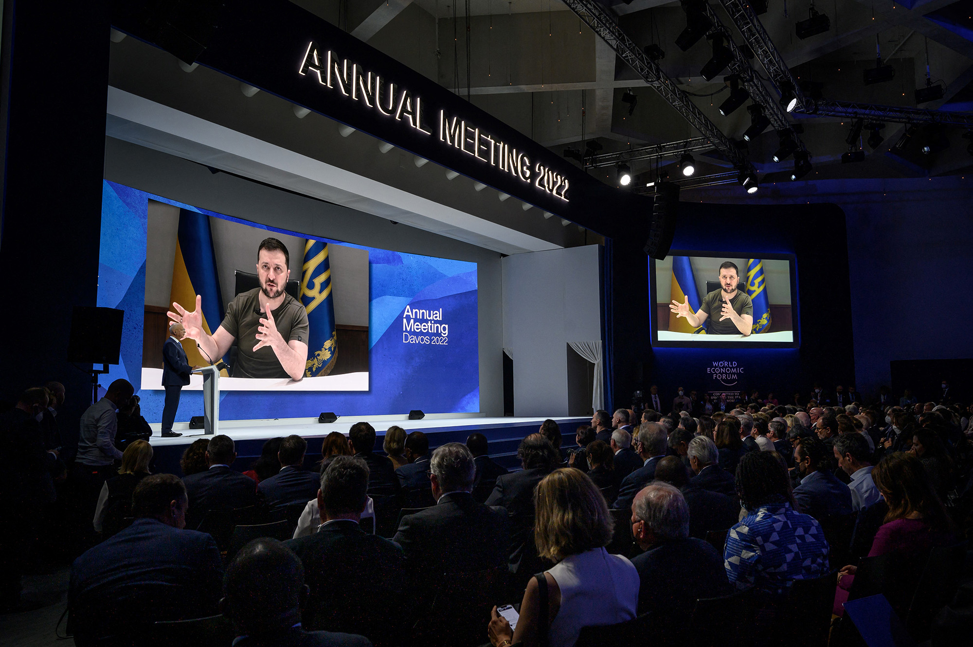 Ukrainian President Volodymyr Zelensky is seen on a giant screen during his address by video conference as part of the World Economic Forum (WEF) annual meeting in Davos, Switzerland, on May 23.