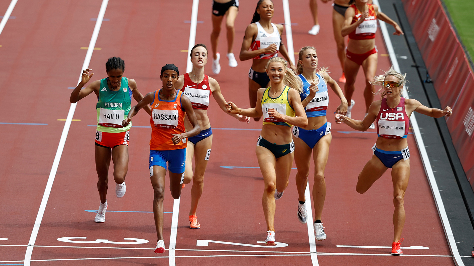 Sifan Hassan crosses the line to finish first during a 1,500 meter heat on Monday.