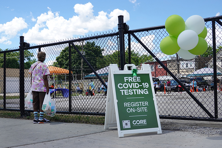 A sign alerts residents to a mobile COVID-19 testing site set up on a vacant lot in the Austin neighborhood on June 23, 2020 in Chicago, Illinois. 