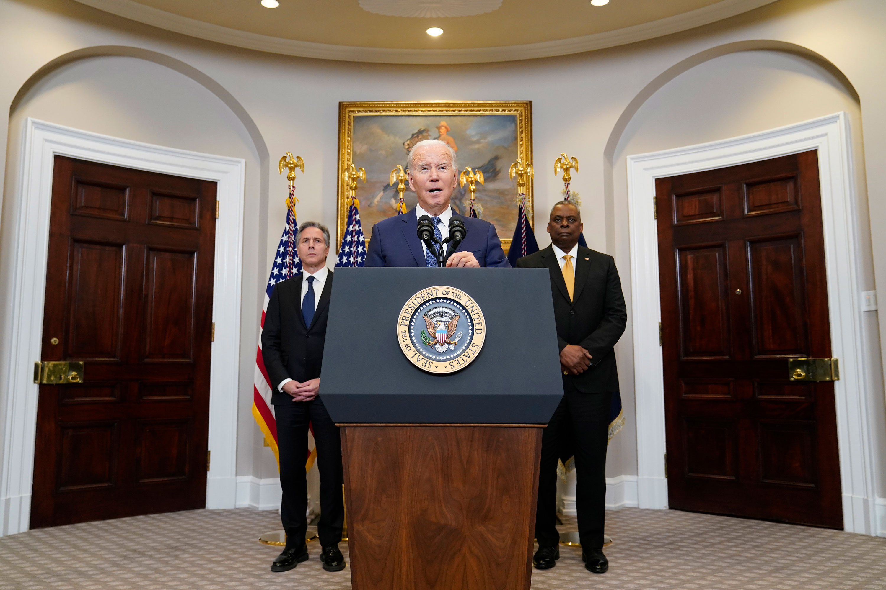 President Joe Biden speaks from the White House with Secretary of State Antony Blinken, left, and Defense Secretary Lloyd Austin behind him on Wednesday.