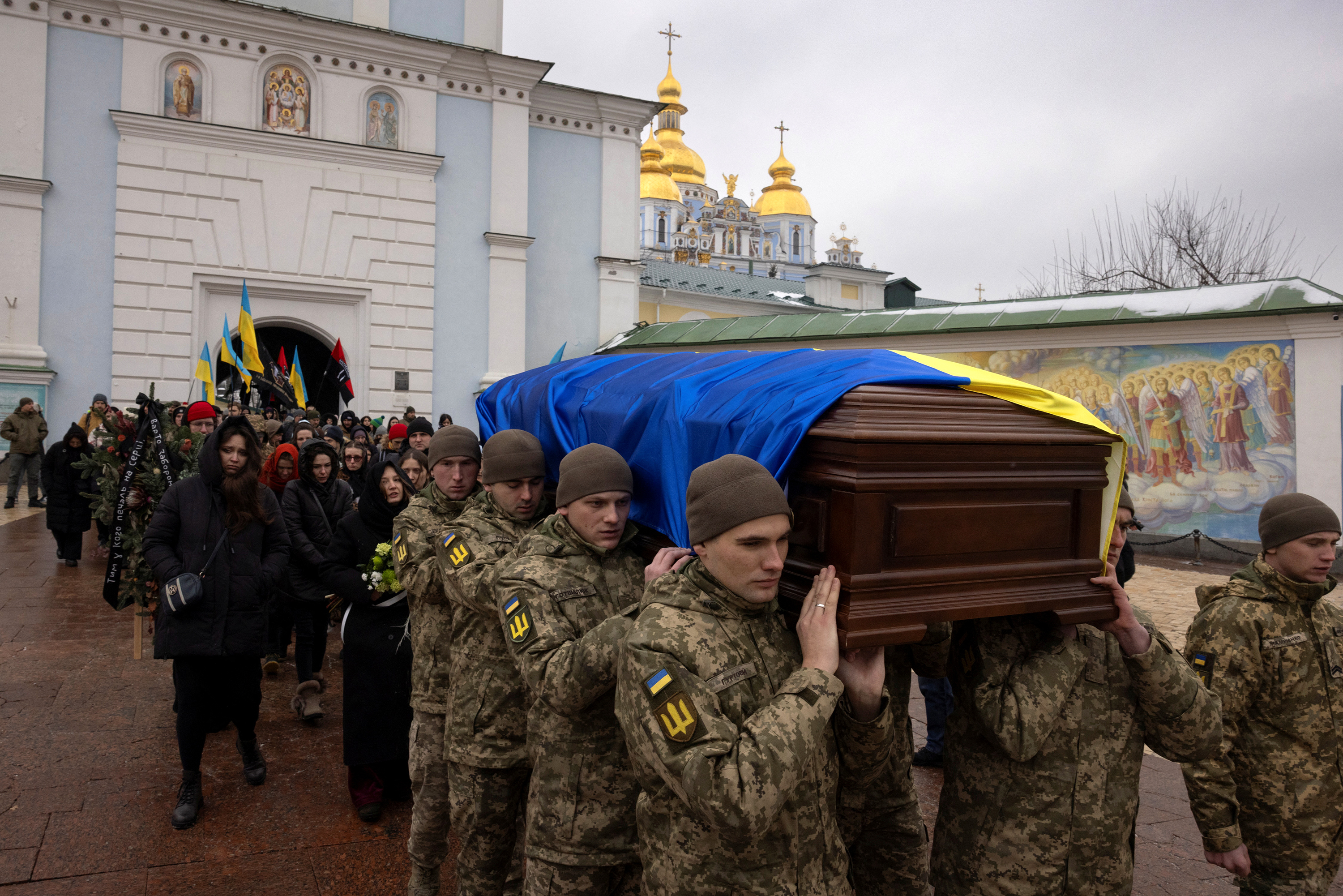 Soldiers carry the coffin of Ukrainian serviceman Maksym Kryvtsov during his funeral ceremony in Kyiv, Ukraine, on January 11. 