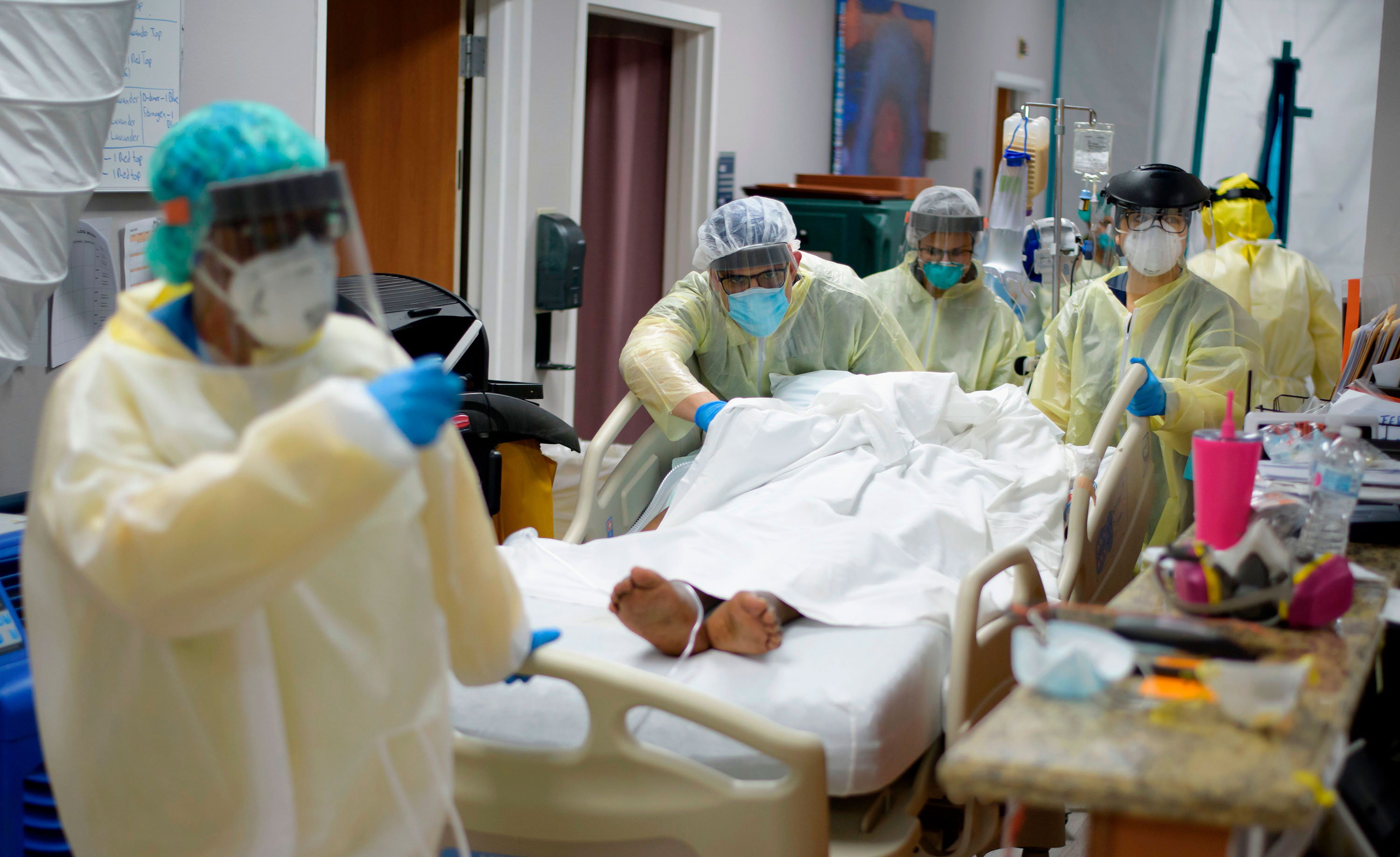 Healthcare workers move a patient in the Covid-19 Unit at United Memorial Medical Center in Houston, Texas, on July 2.