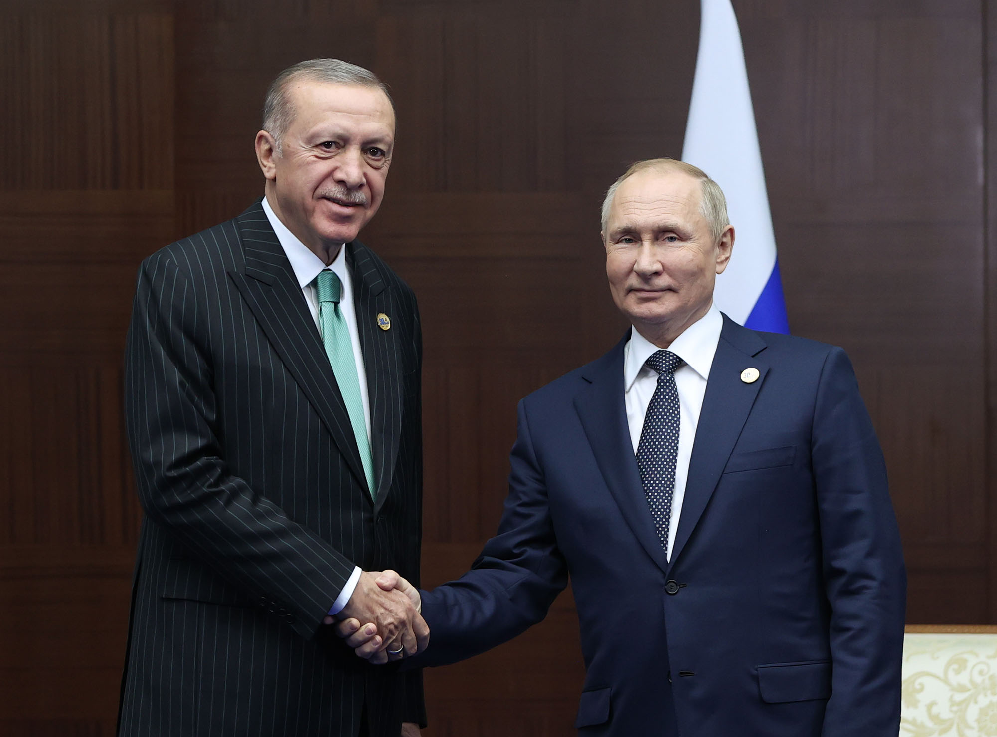 Turkish President, Recep Tayyip Erdogan, left, meets Russian President Vladimir Putin on the sidelines of the Conference on Interaction and Confidence Building Measures in Asia (CICA) in Astana, Kazakhstan, on October 13.