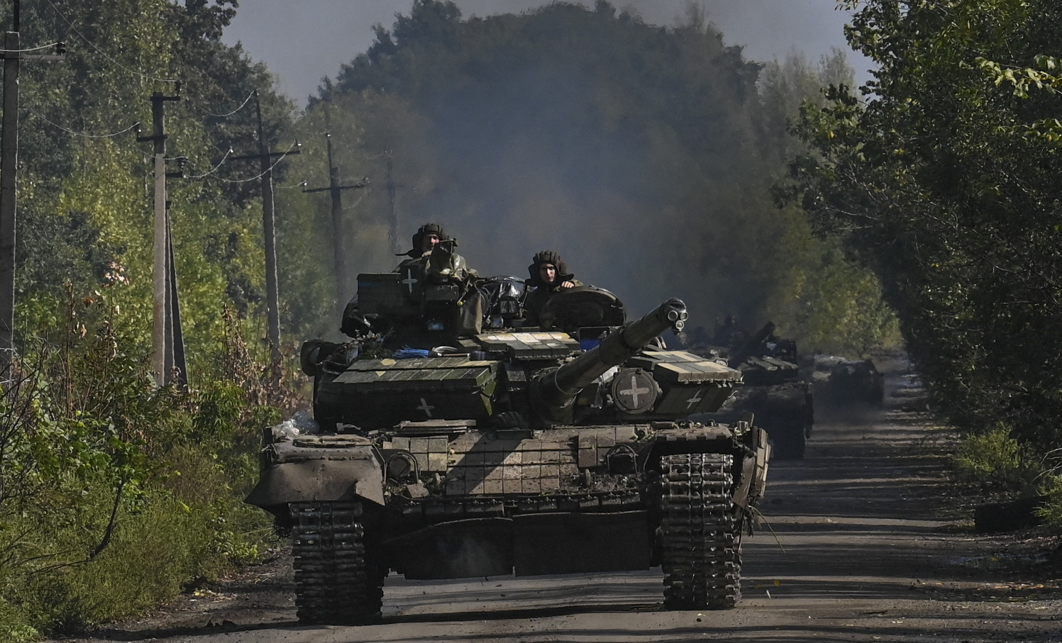 Ukrainian soldiers ride a tank in Novoselivka, Ukraine, on September 17.
