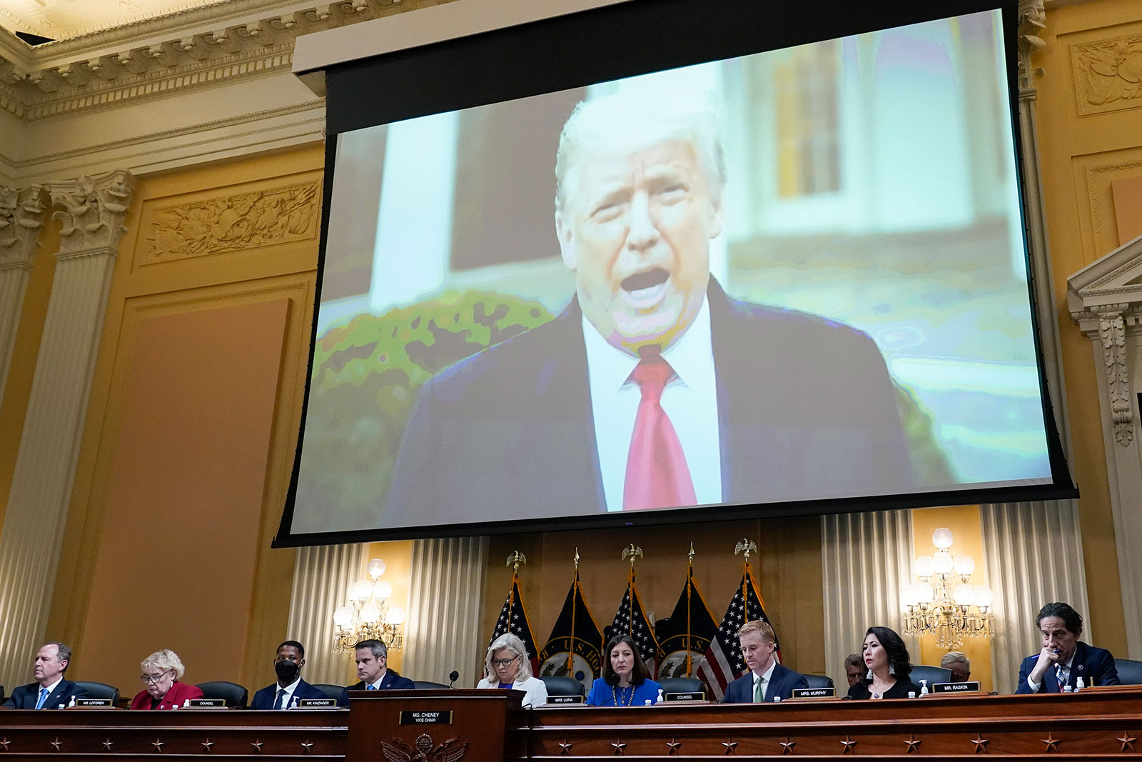 A video of former President Donald Trump is shown on a screen during a House select committee hearing on July 21. 