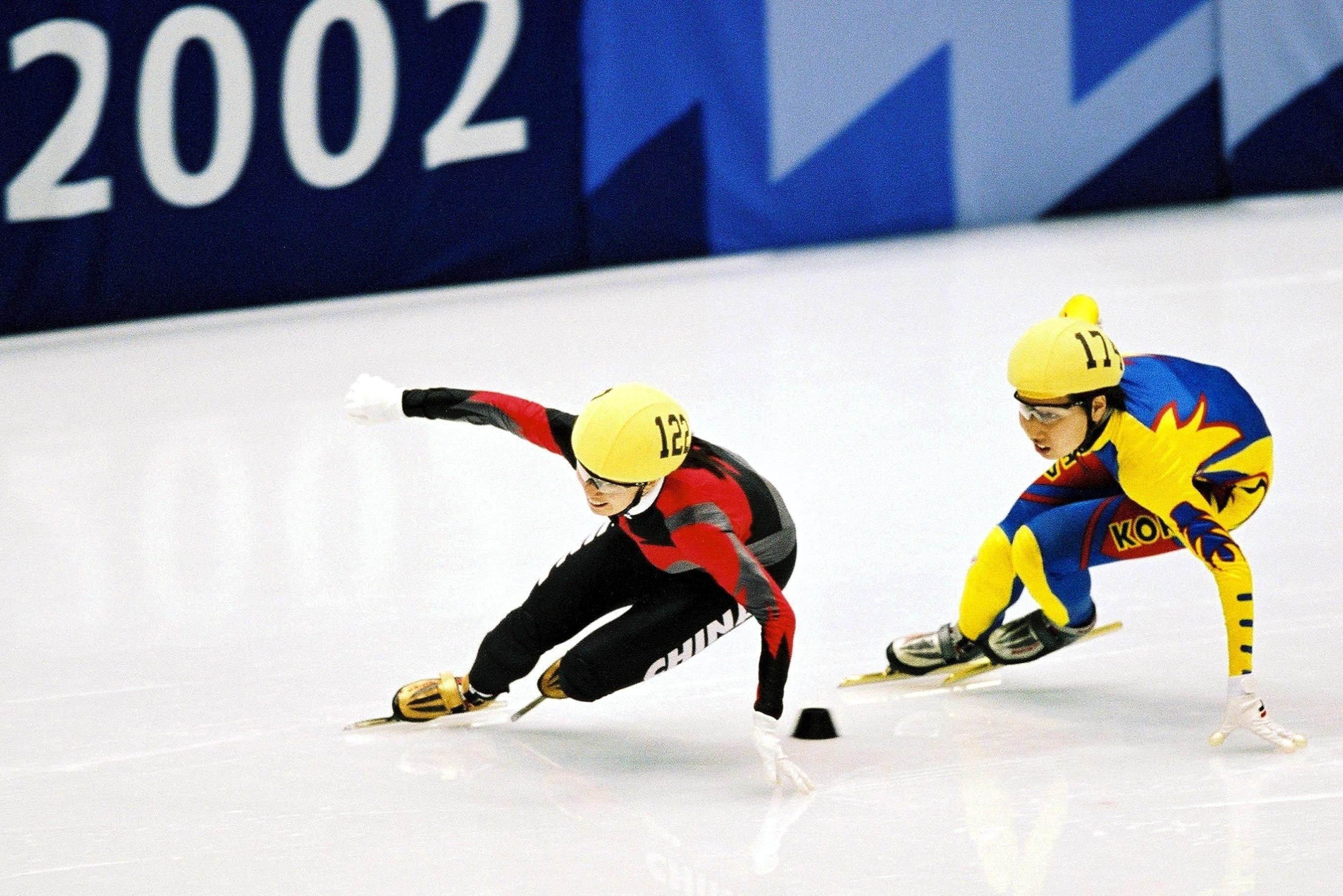 Yang Yang (L) leading Korea's Ko Hyun-Gi during the women's 1,000m short track speed skating finals at the 2002 Olympic Winter Games in Salt Lake City on February 23, 2002.