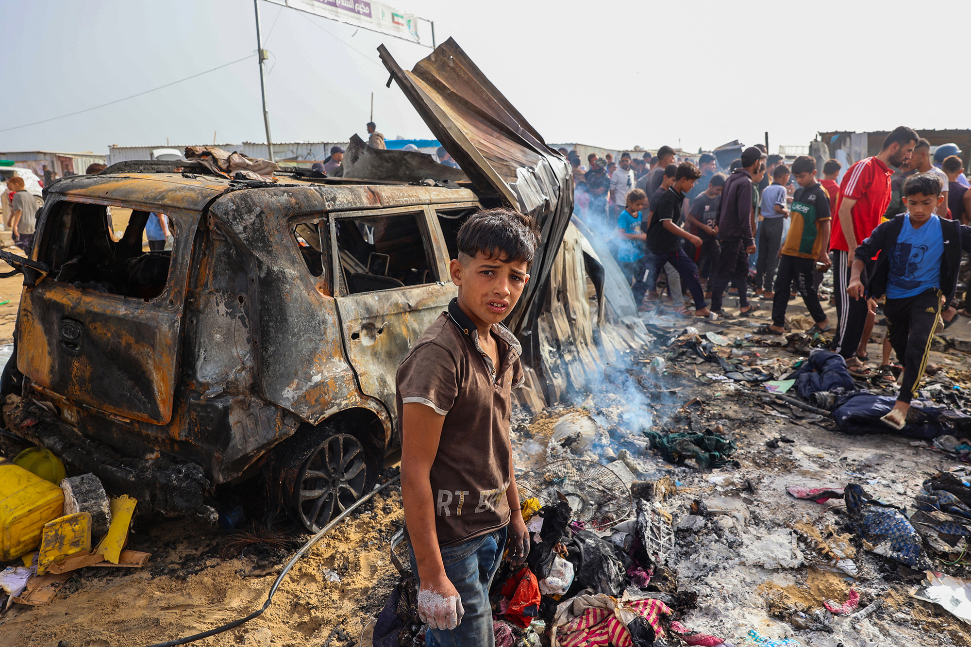 Palestinians gather at the site of an Israeli strike on a camp area housing internally displaced people in Rafah, Gaza, on May 27.