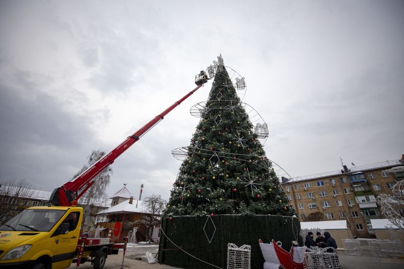 Workers set up a Christmas tree in Sophia Square on December 16, in Kyiv, Ukraine. 