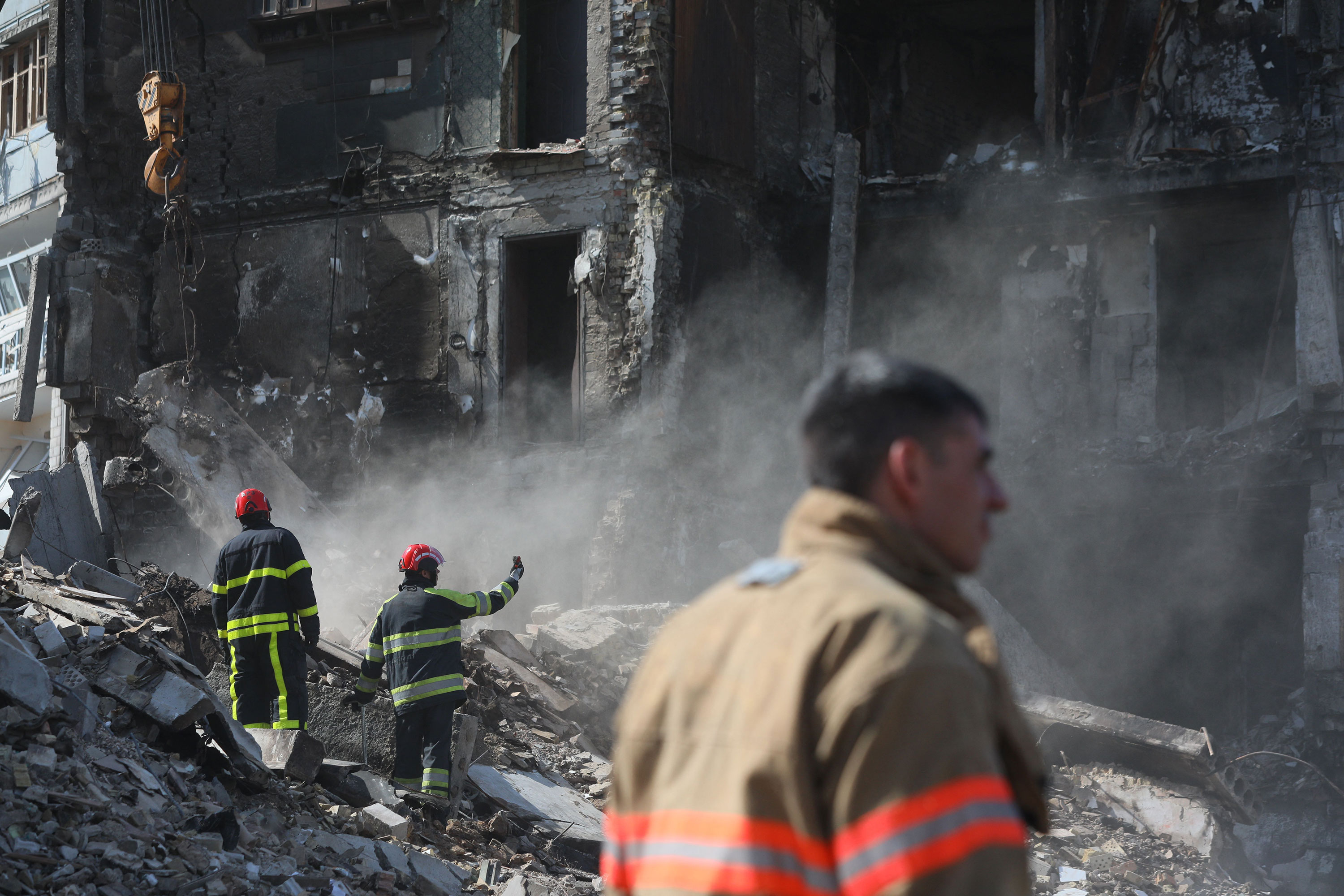 Rescuers remove rubble of a damaged building in Borodianka, Ukraine, on April 7.