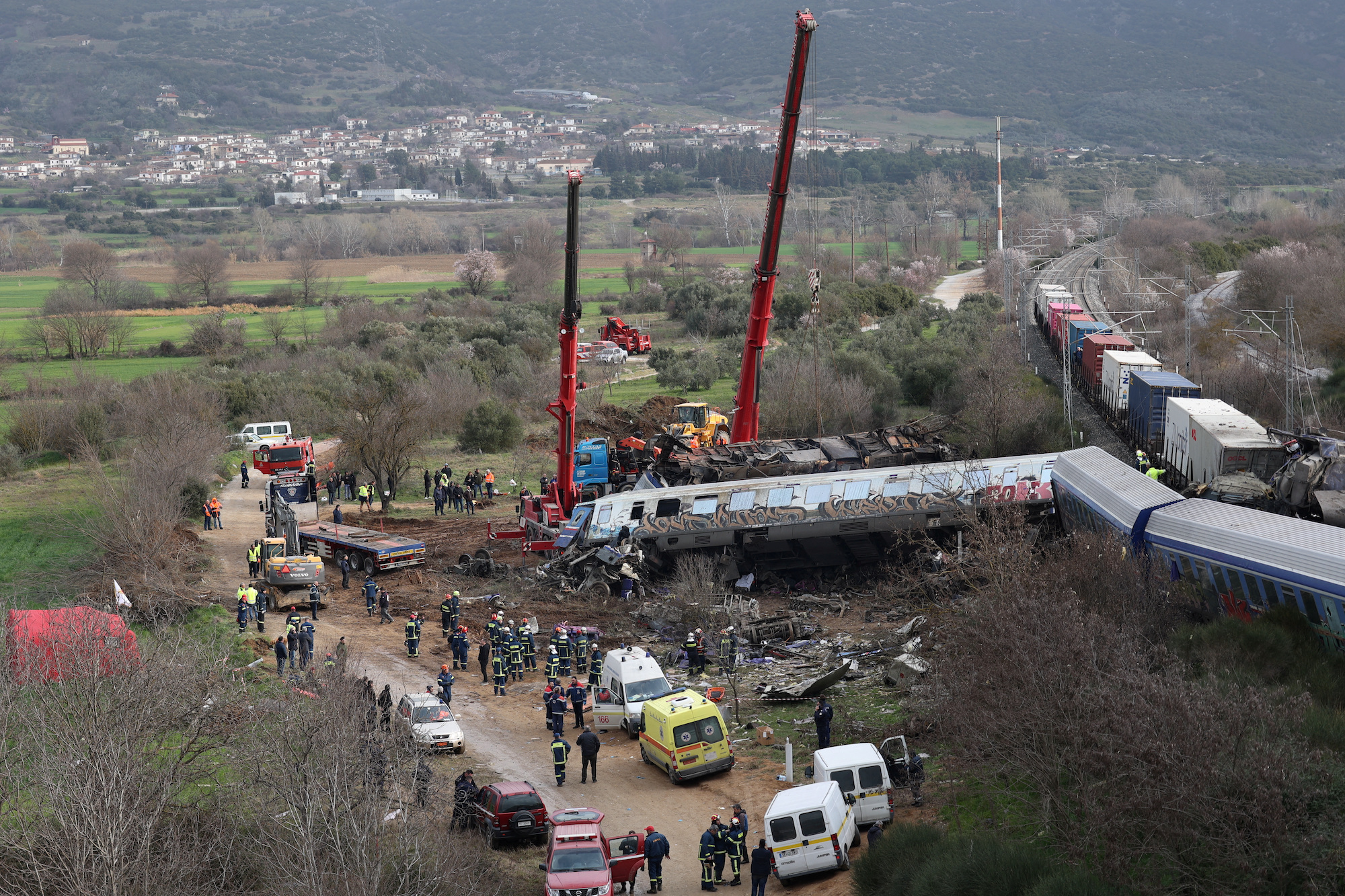 Rescuers operate at the site of a crash near the city of Larissa on Wednesday.