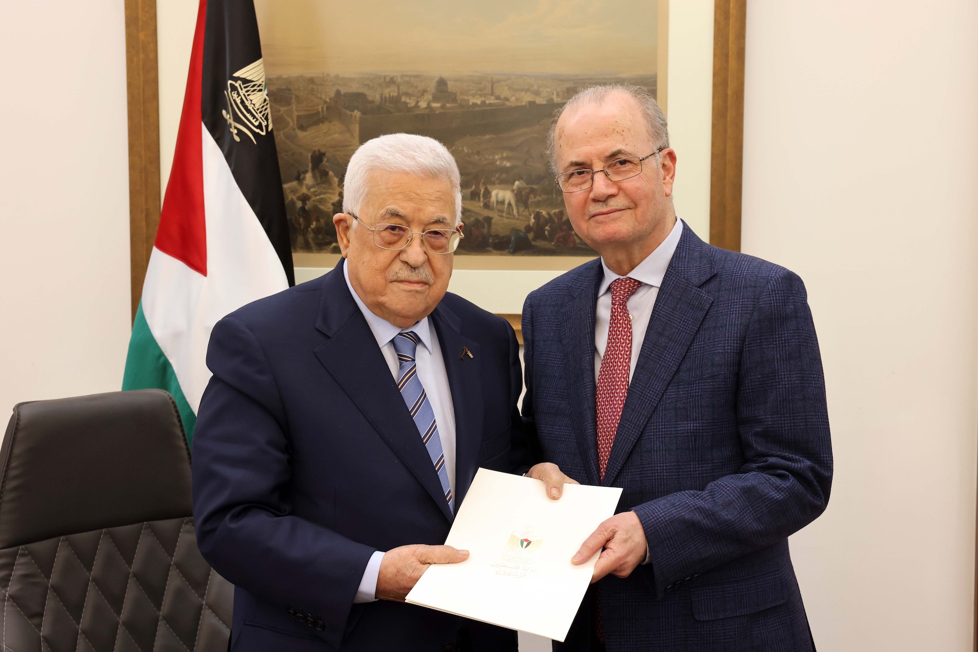 Palestinian President Mahmoud Abbas, left, poses for a photo with Mohammed Mustafa after appointing him as the new Prime Minister in Ramallah, West Bank, on Thursday.