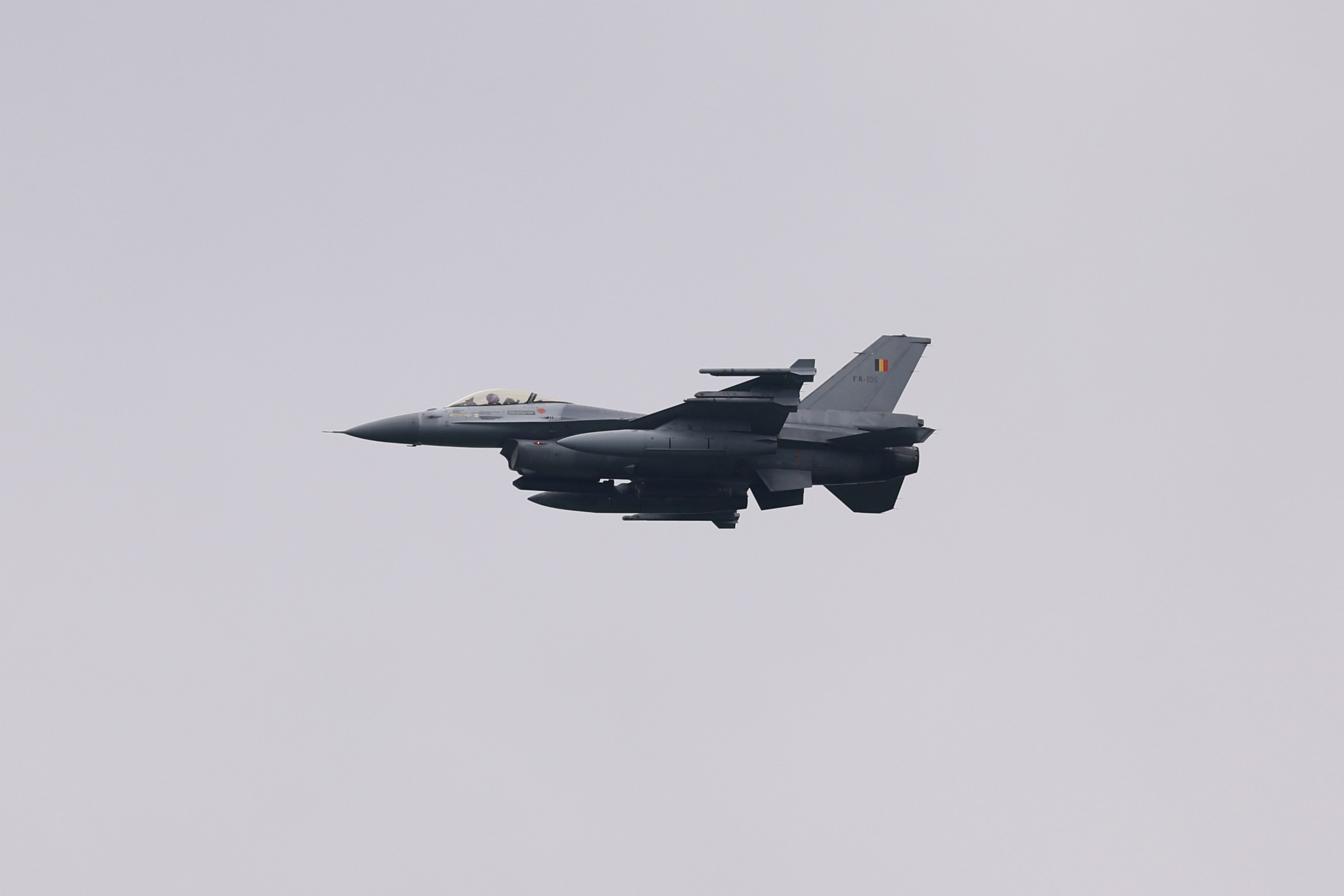 A Belgian Air Force F-16 is seen flying over the Rinkven International Golf Club on May 12, in Anterwp, Belgium.