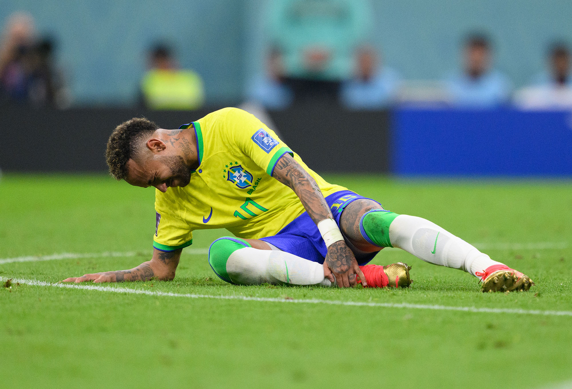 Brazil’s Neymar holds his ankle after getting injured in a match against Serbia on Thursday, November 24. 