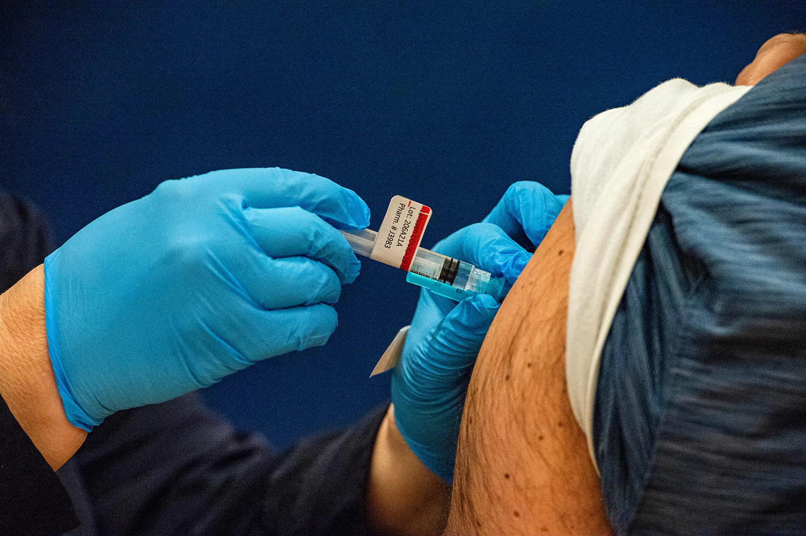 A health worker administers a Johnson & Johnson Covid-19 vaccine in Bidderford, Maine, on April 26.