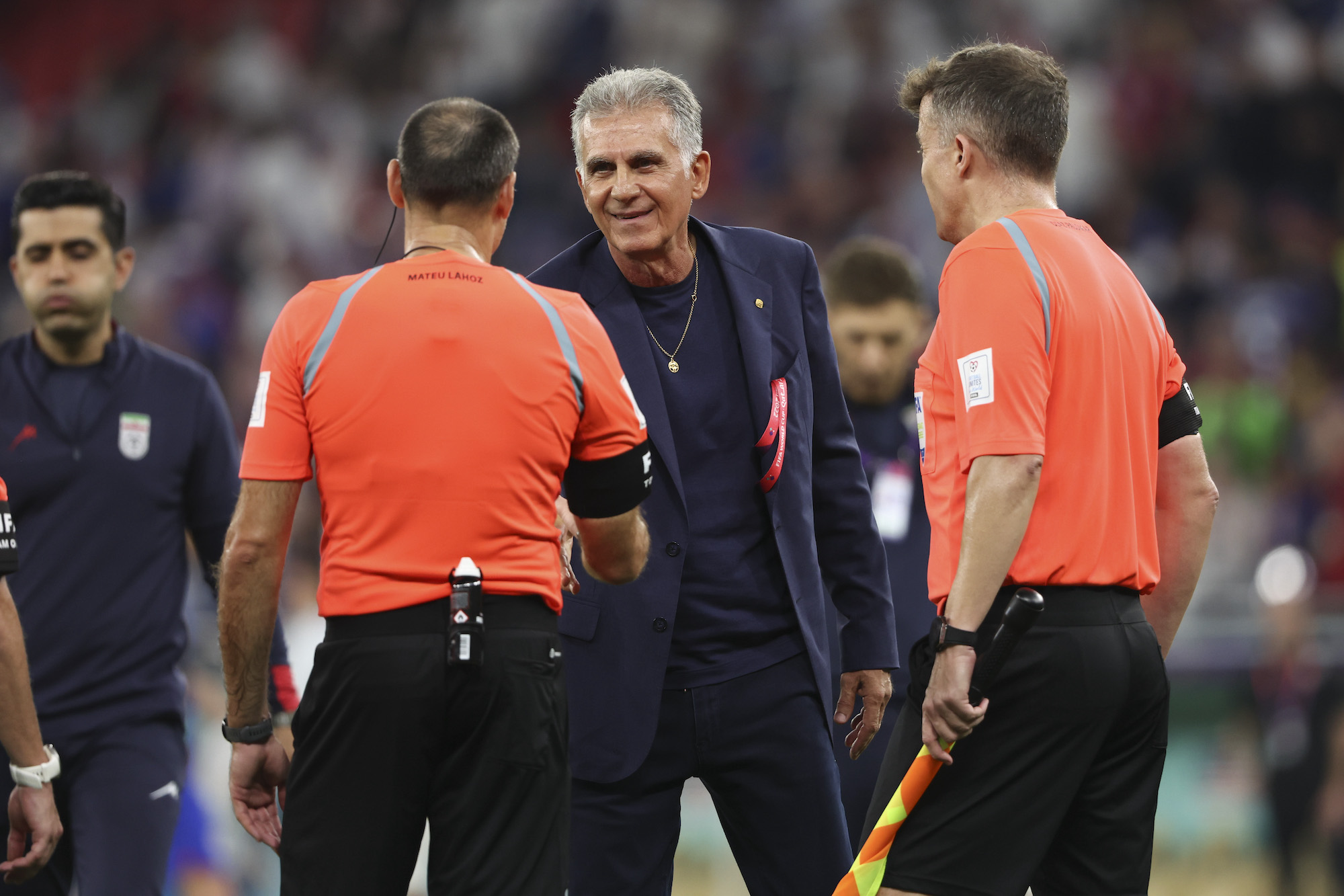 Iran coach Carlos Queiroz speaks to referees at full time after a 1-0 loss to USA at Al Thumama Stadium on Tuesday.