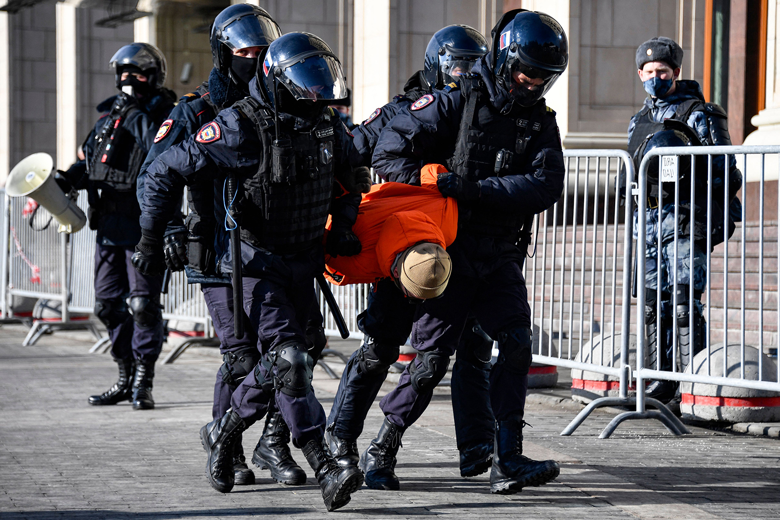 Police officers detain a man during a protest against Russian military action in Ukraine, in Manezhnaya Square in central Moscow on March 13.