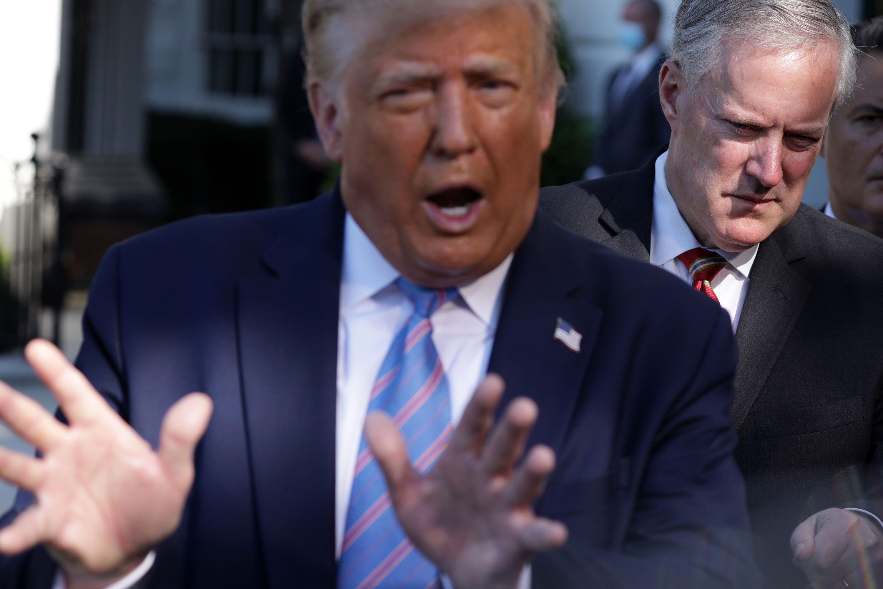 Former White House chief of staff Mark Meadows listens as former President Donald Trump speaks on the South Lawn of the White House in July 2020.
