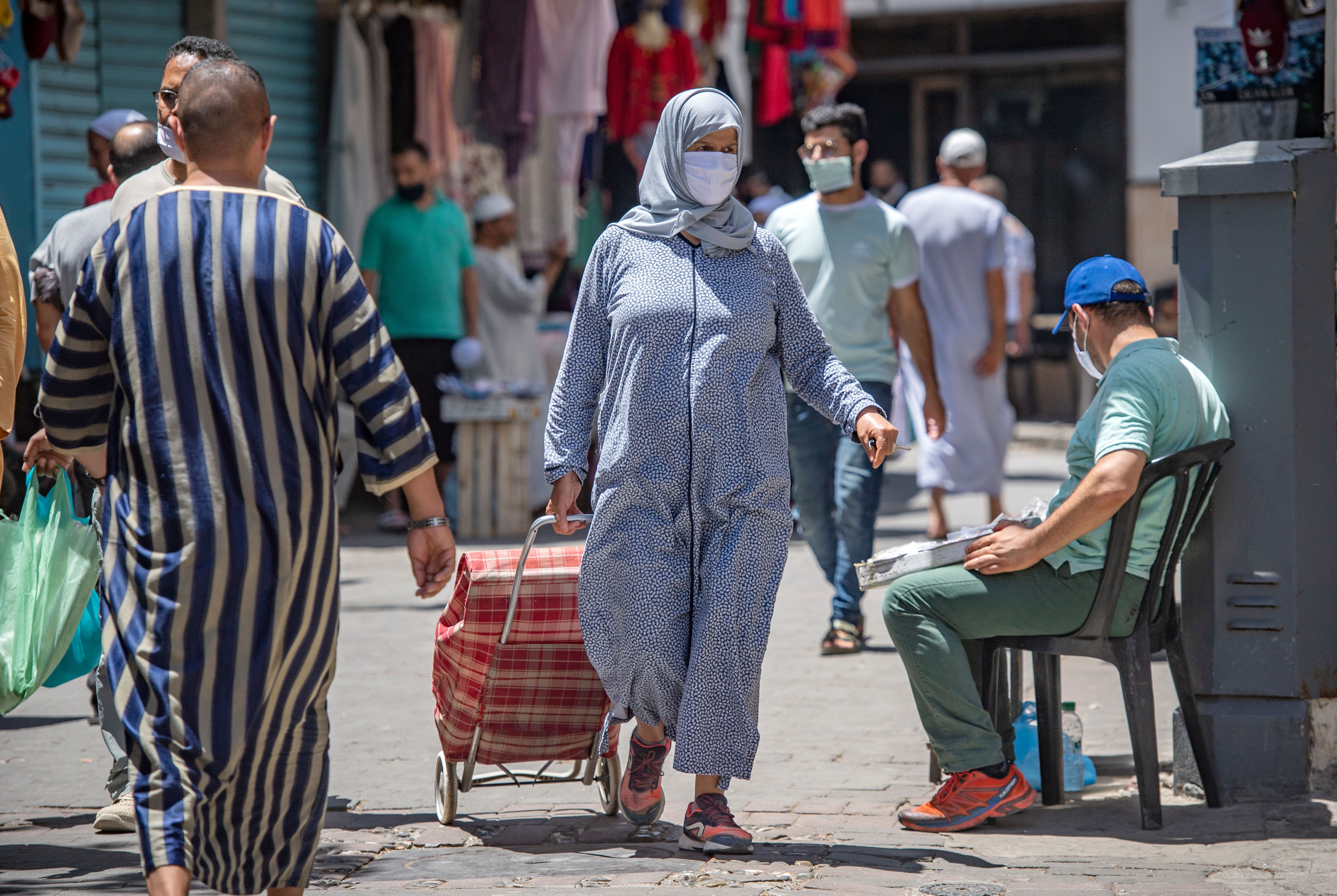 People walk in Tangier, Morocco, on July 14.