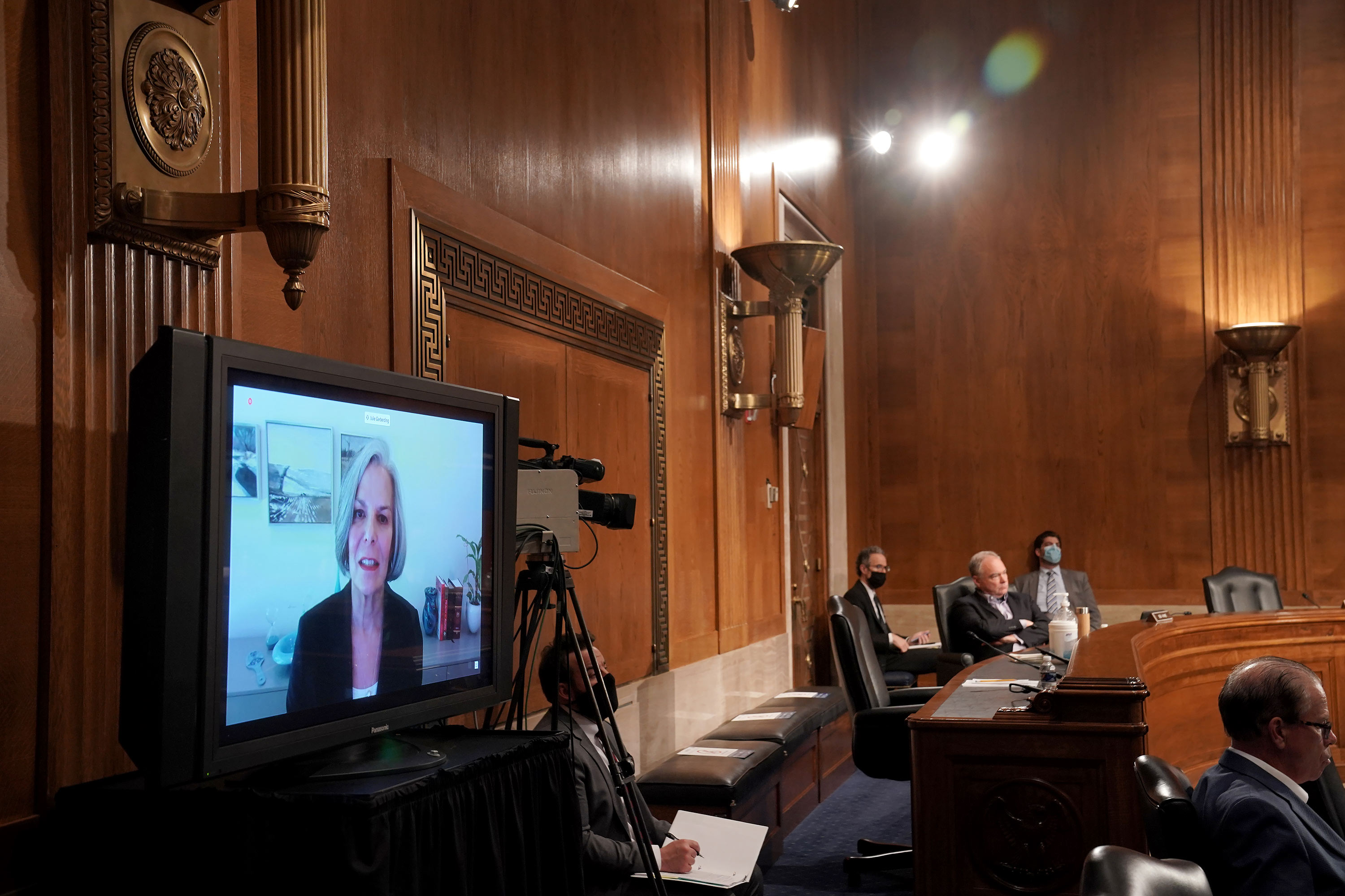 Dr. Julie Gerberding, former director of the US Centers for the Centers for Disease Control and Prevention, is seen on a screen as she gives an opening statement during a Senate Health, Education, Labor and Pensions Committee hearing on Capitol Hill on June 23 in Washington, DC. 