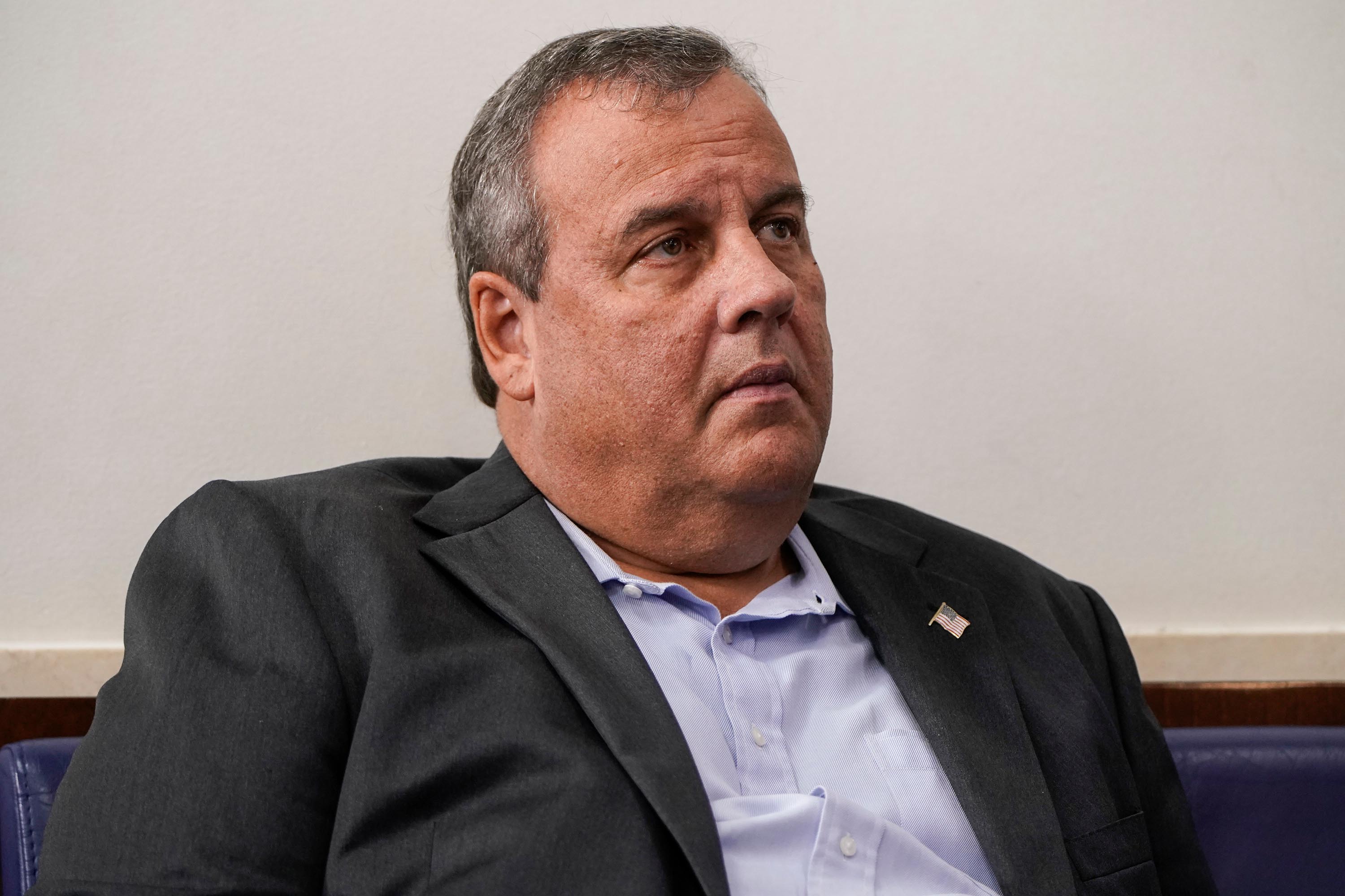 Former New Jersey Governor Chris Christie listens as President Donald Trump speaks during a news conference at the White House on September 27.