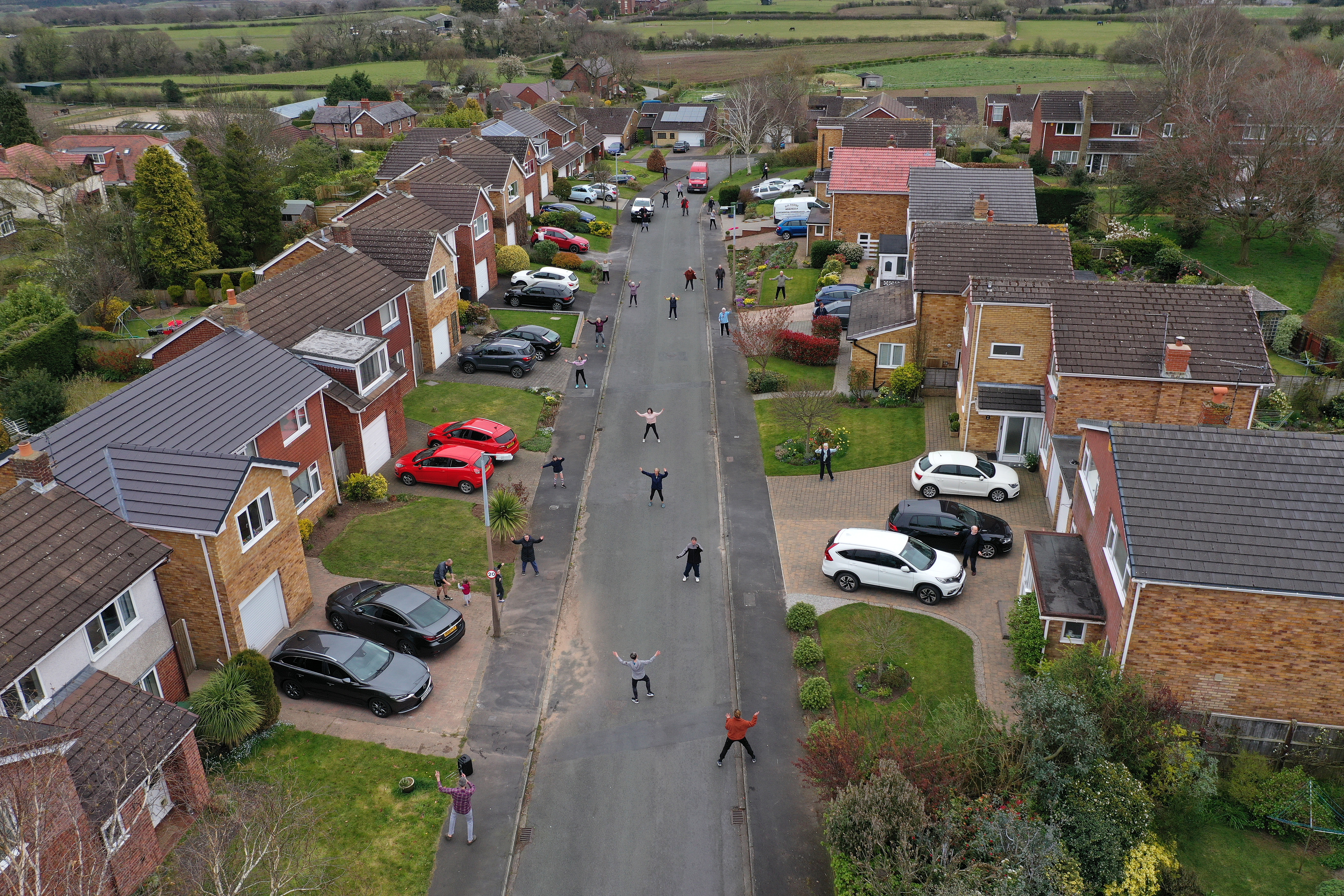 Neighbors in the town of Frodsham, England, participate in a daily social distance dancing and fitness event on April 4. 