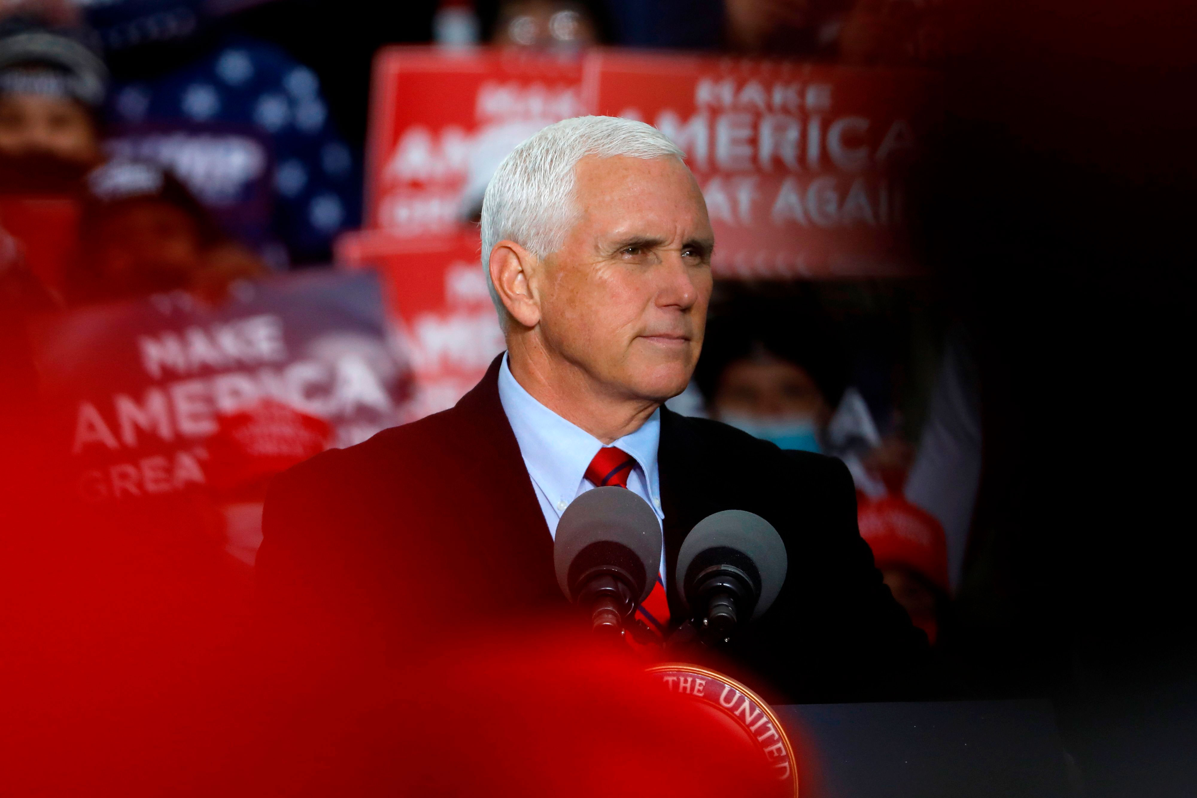 Vice President Mike Pence speaks during a campaign event at Oakland County International Airport in Waterford Township, Michigan, on October 22.