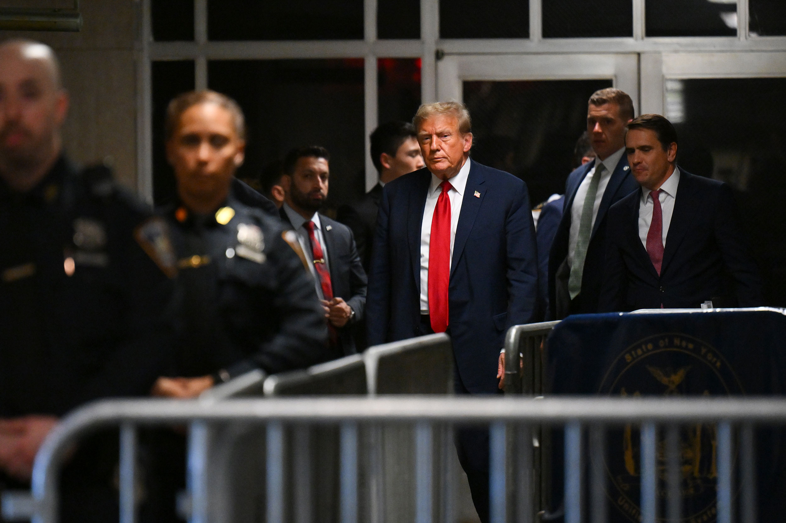 Former President Donald Trump leaves the courtroom after the first day of his criminal hush money trial in New York on Monday, April 15.