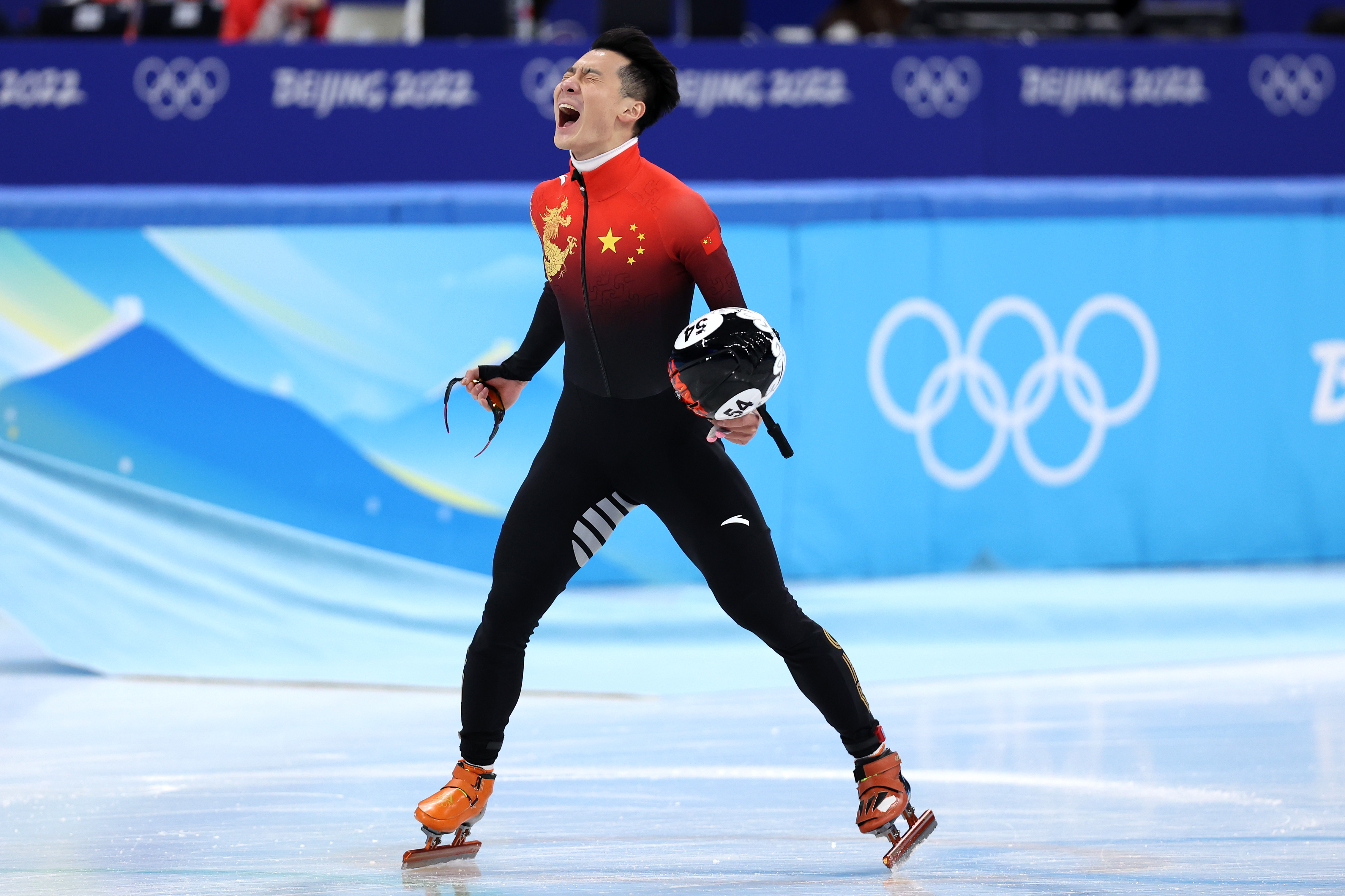 China's Ren Ziwei celebrates winning the gold medal after the men's 1,000m short track speed skating final on February 7.