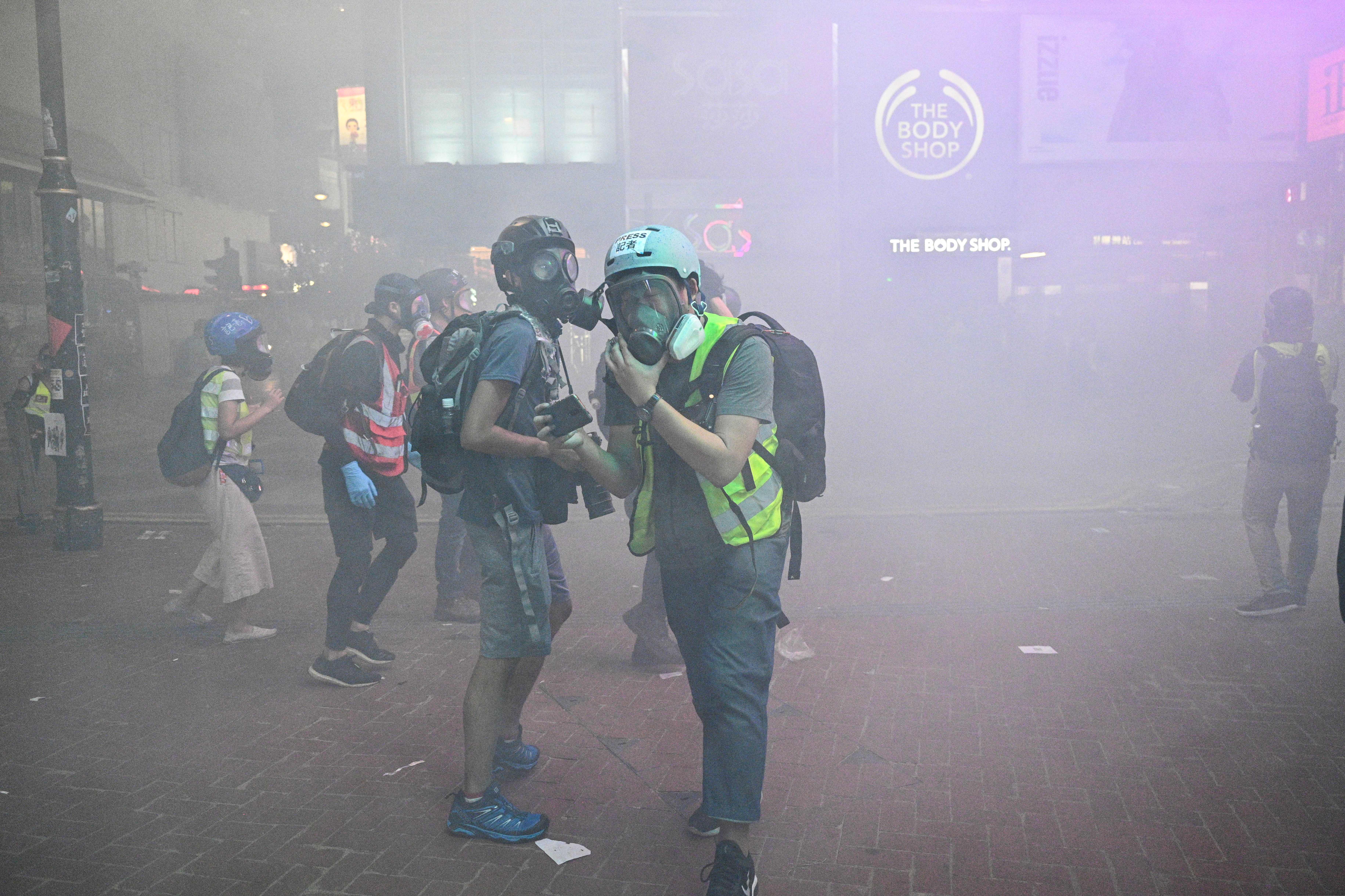 Police was firing tear gas at the protesters. 