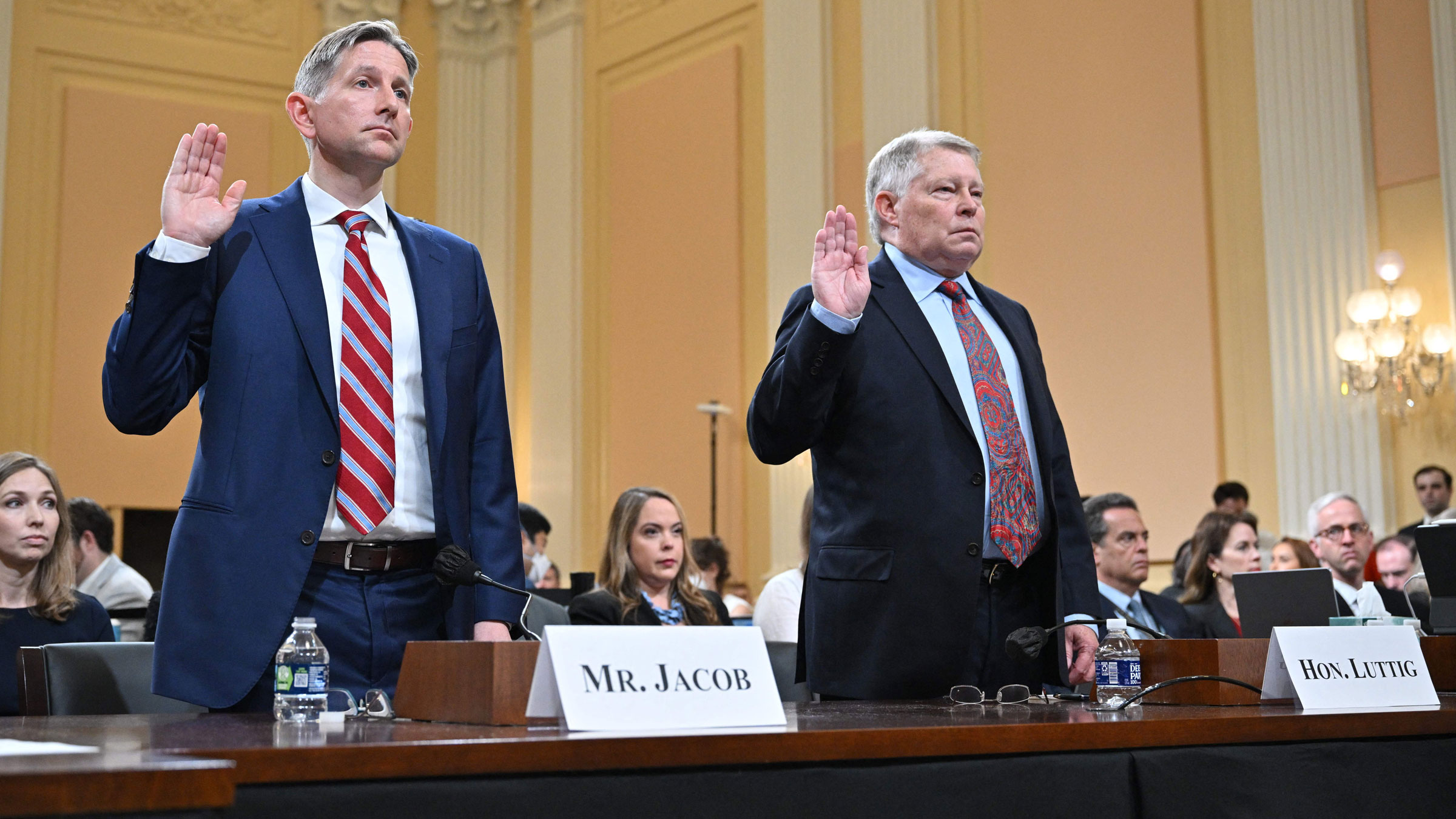 Greg Jacob, left, and J. Michael Luttig are sworn in before testifying on Thursday.