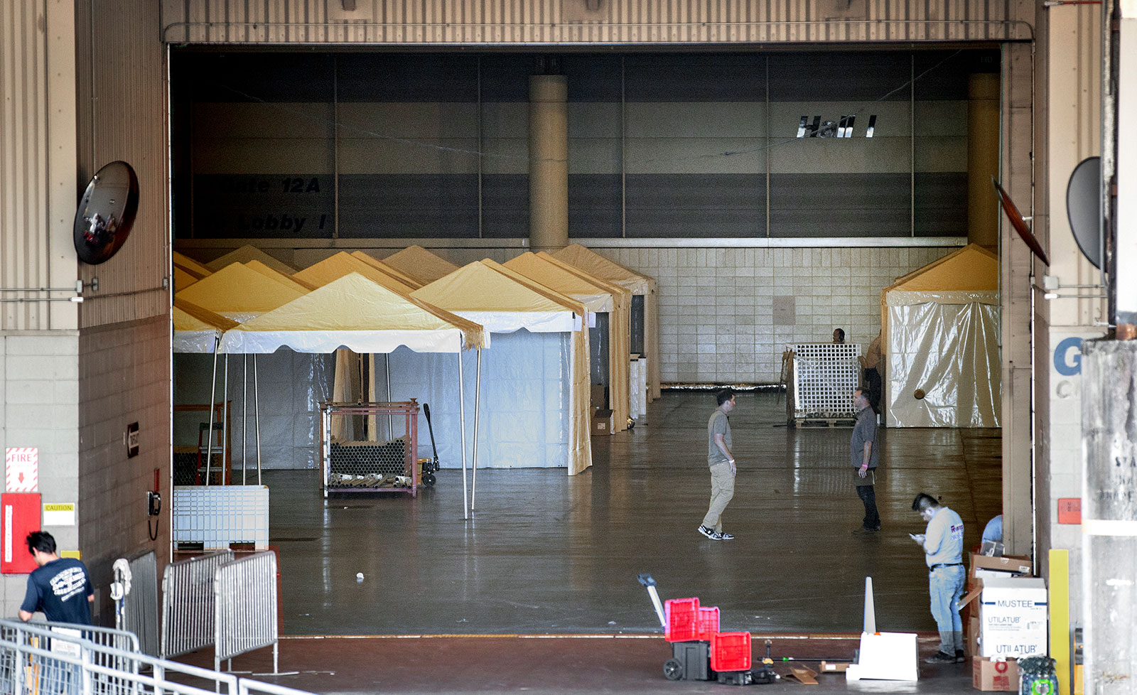 Workers convert the Ernest N. Morial Convention Center into a temporary hospital on Friday, March 27, in New Orleans, Louisiana.