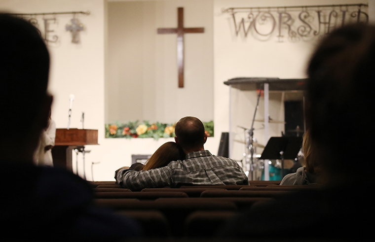 People sit at a prayer service for Saugus High School at Bouquet Canyon Church after a shooting at the school left two students dead and three wounded.