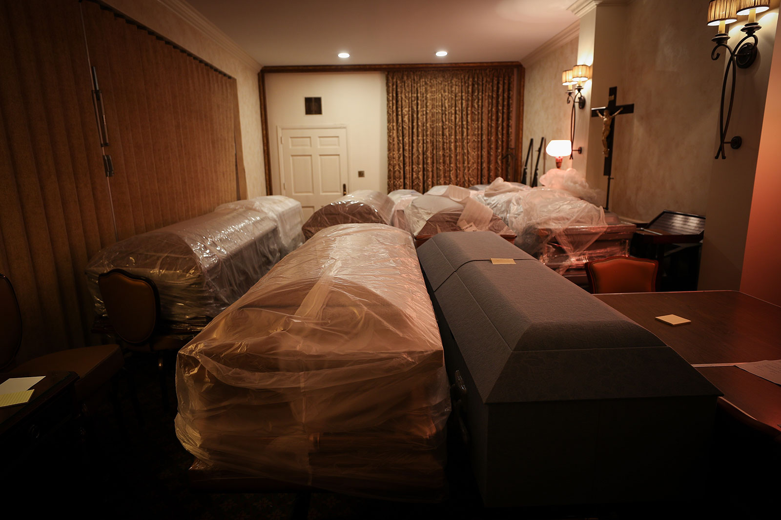 Caskets holding coronavirus victims are seen at the Gerard J. Neufeld funeral home in Queens, New York, on April 29. 