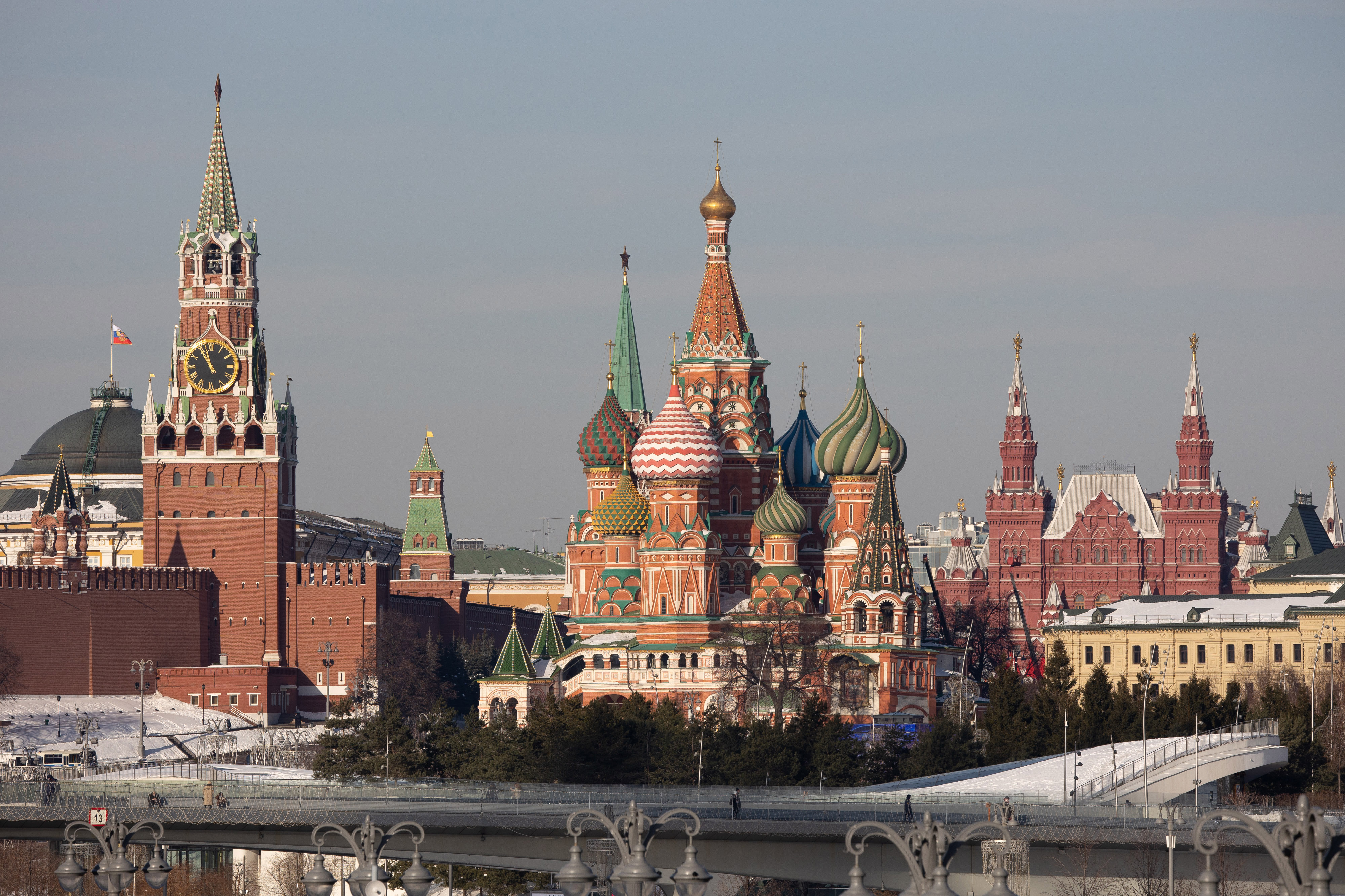 The Spasskaya tower of the Kremlin, left, and Saint Basil's Cathedral, center, in Moscow, Russia, on February 15.
