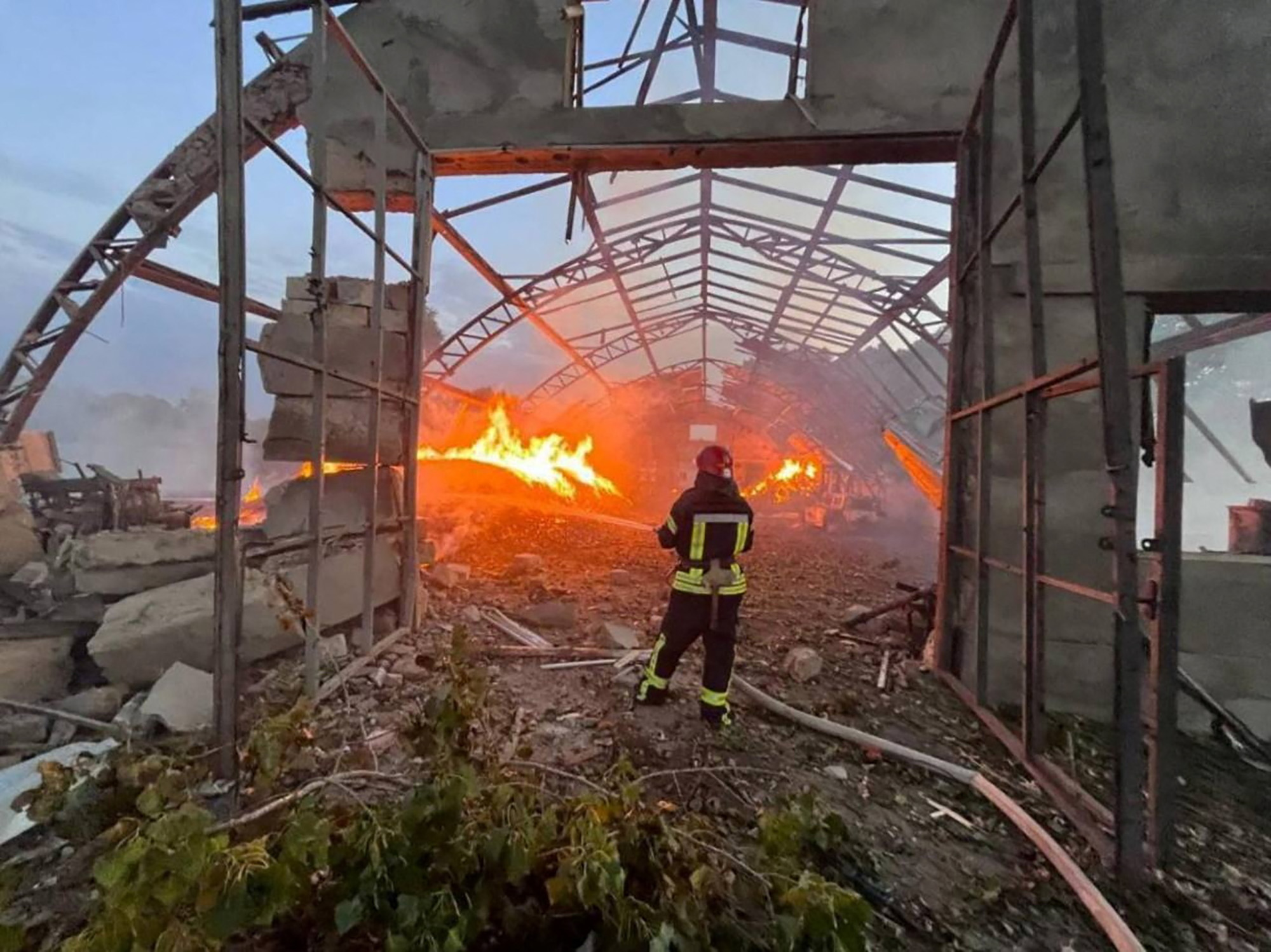 A firefighter works at a site that was hit amid Russian drone attacks in Odesa region, Ukraine, in this handout image released September 4.