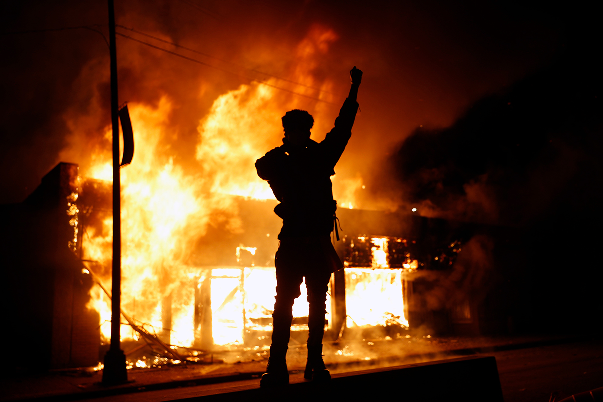 A check-cashing business burns during protests in Minneapolis on Friday. 