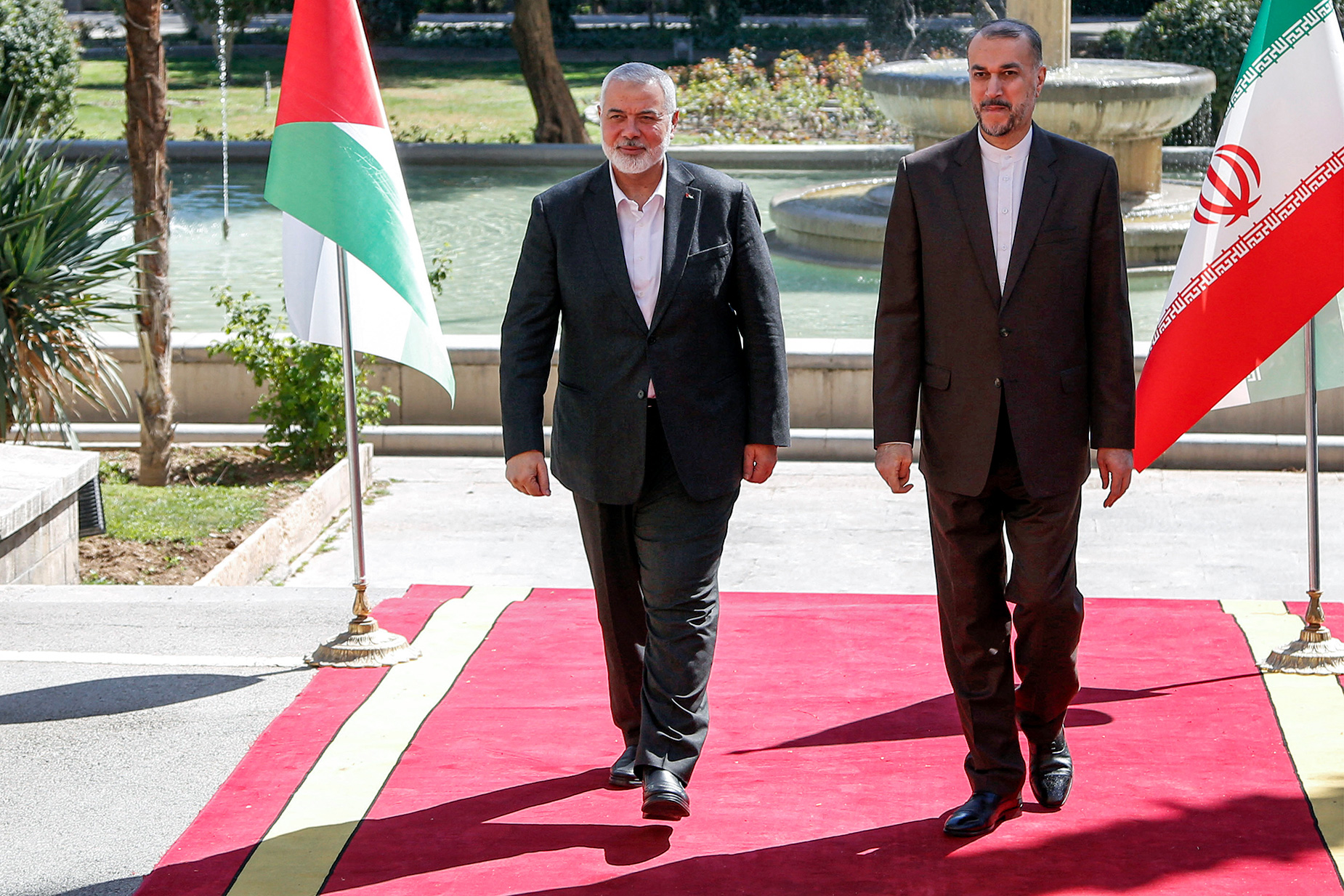 Iran's Foreign Minister Hossein Amir-Abdollahian, right, receives Hamas political bureau head Ismail Haniyeh at the foreign ministry headquarters in Tehran on Tuesday, March 26.