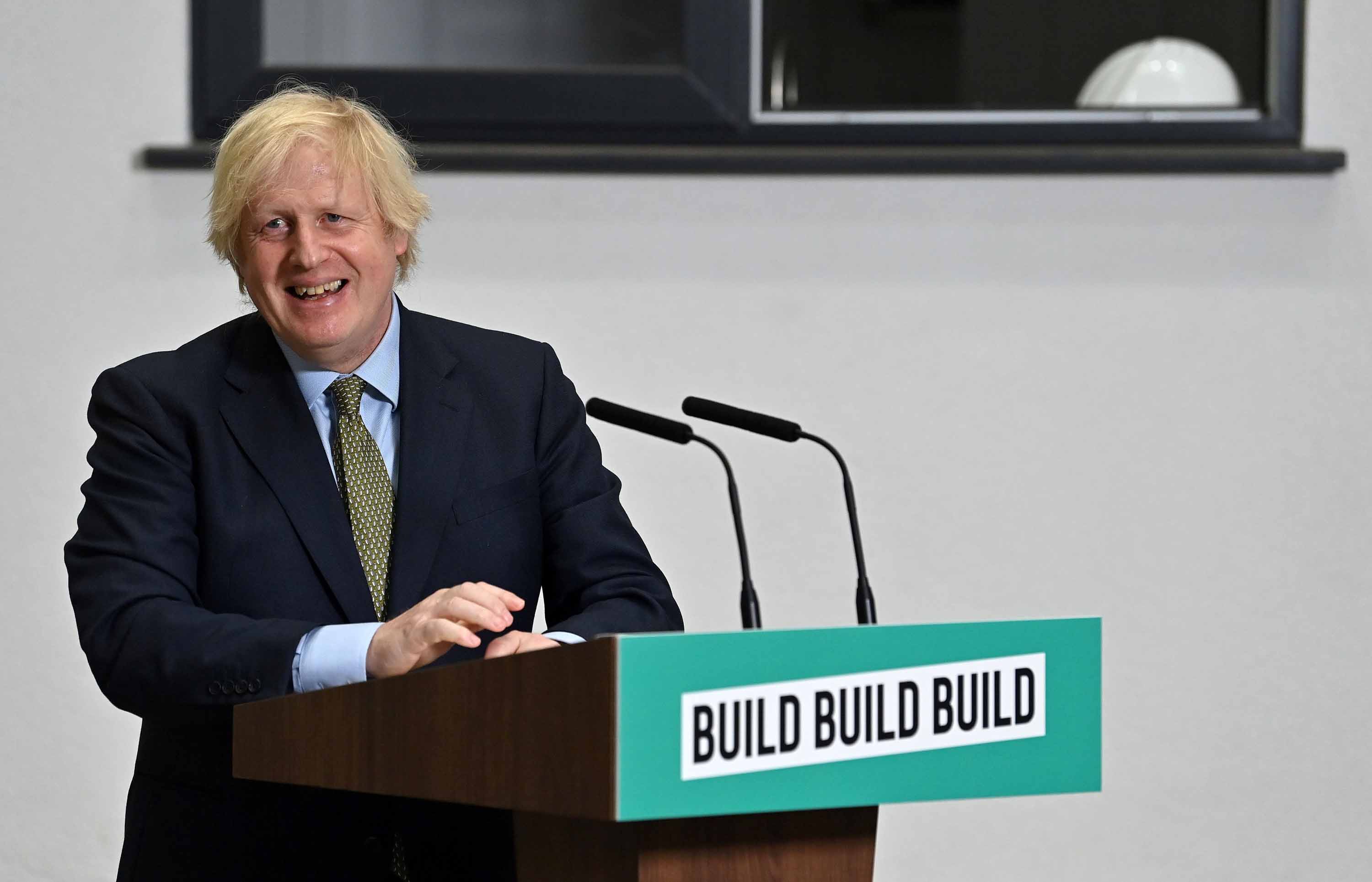 Britain's Prime Minister Boris Johnson takes questions after delivering a speech during his visit to Dudley College of Technology in Dudley, England, on June 30.
