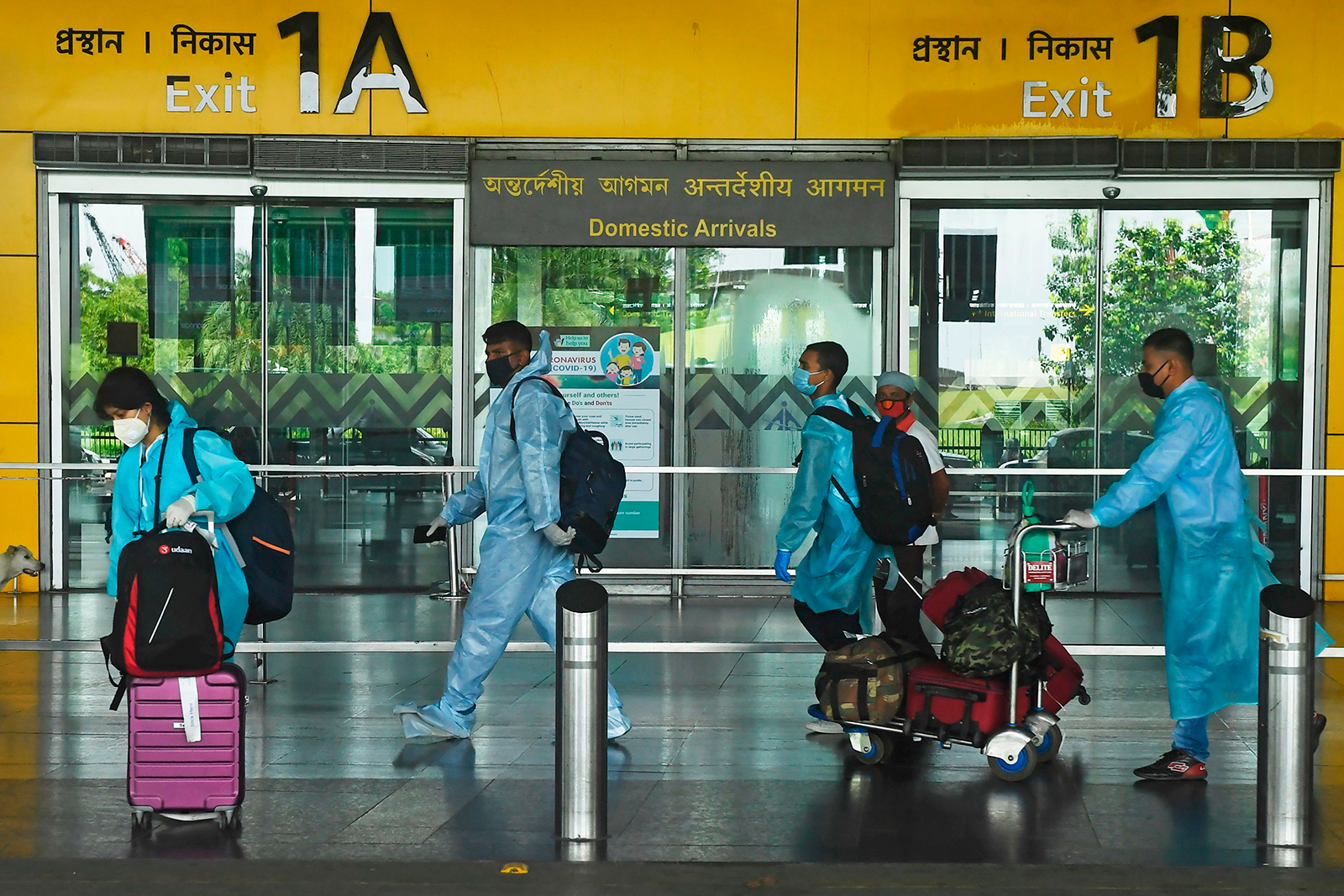 Air passengers wearing protective suits at Netaji Subhas Chandra Bose International Airport in Kolkata, India on July 6.