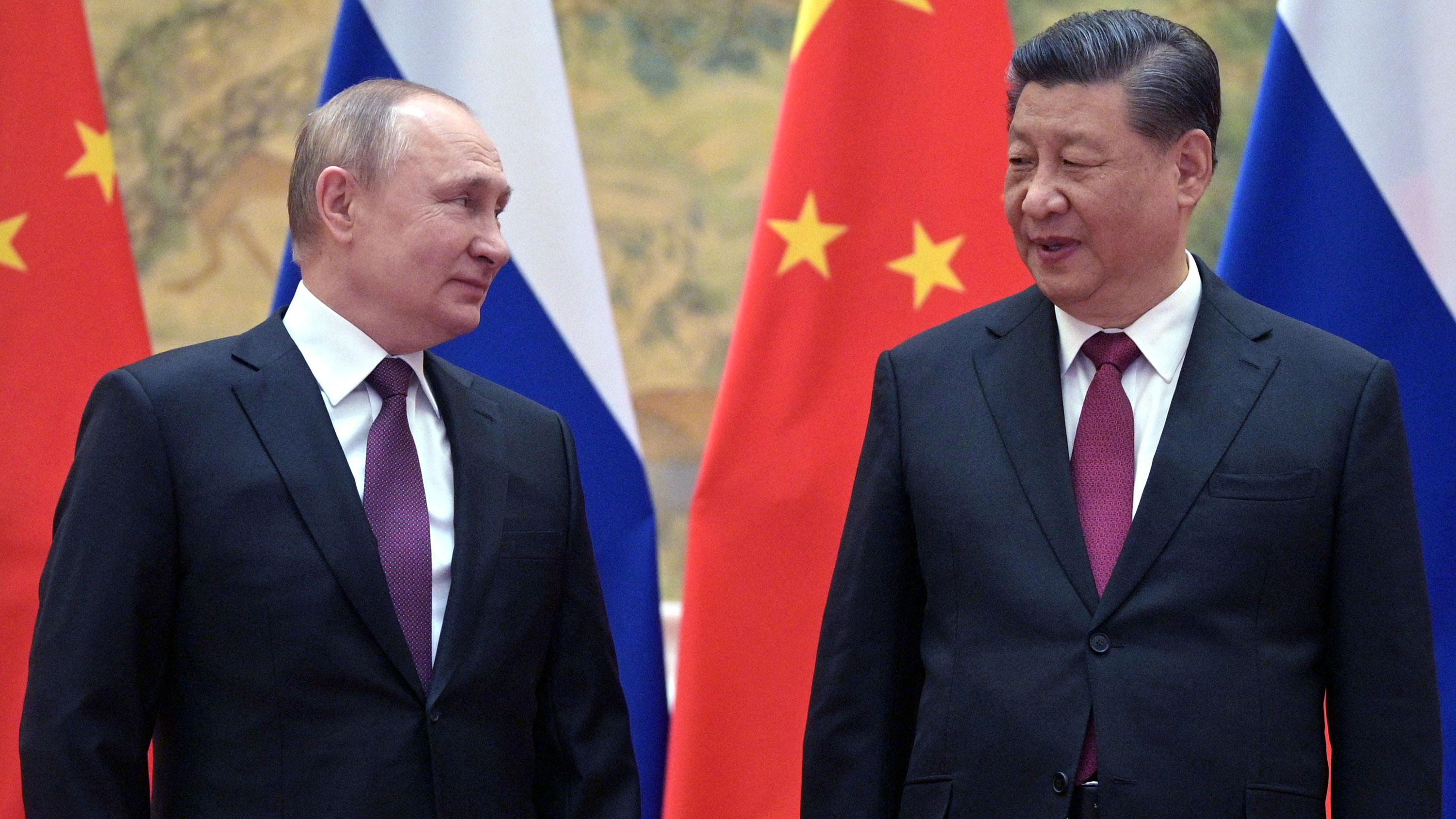 Russian President Vladimir Putin and Chinese President Xi Jinping pose for a photograph during their meeting in Beijing on February 4.