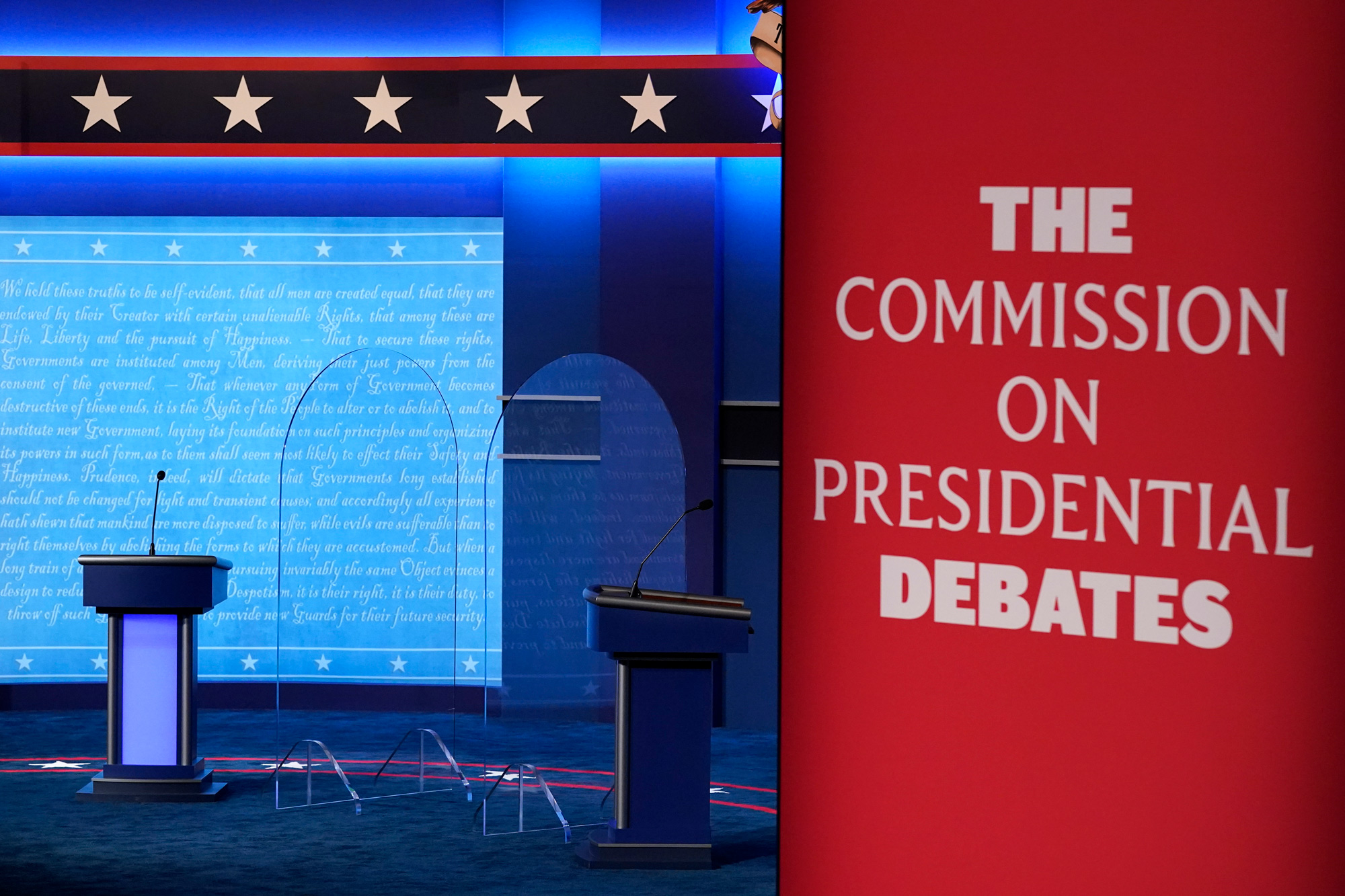 Clear protective panels stand onstage between lecterns as preparations take place for the second Presidential debate at Belmont University on October 21 in Nashville.