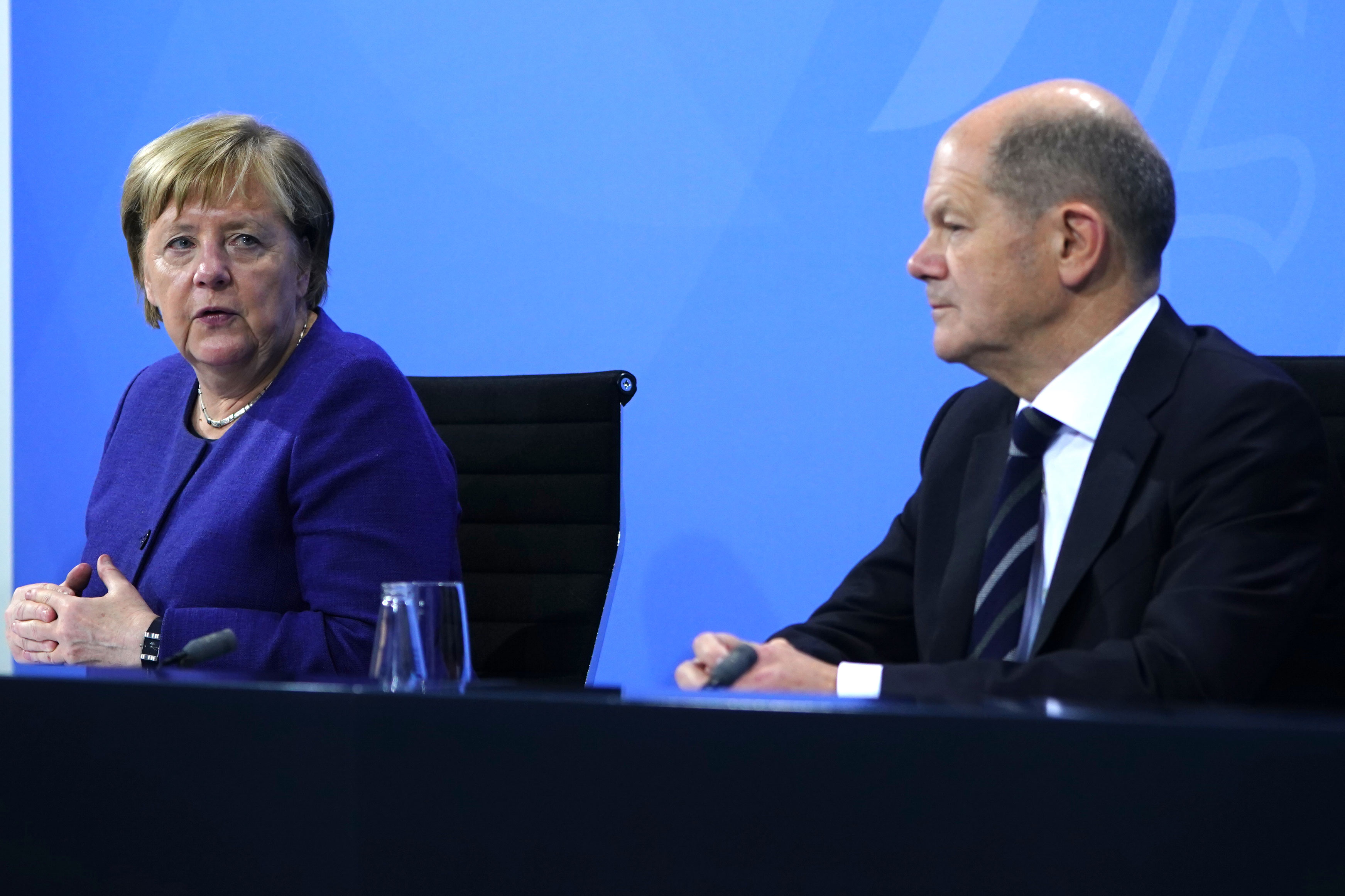 Acting Federal Chancellor Angela Merkel and Acting German Finance Minister Olaf Scholz during a press conference after a meeting on the current coronavirus situation on November 18, 2021 in Berlin.