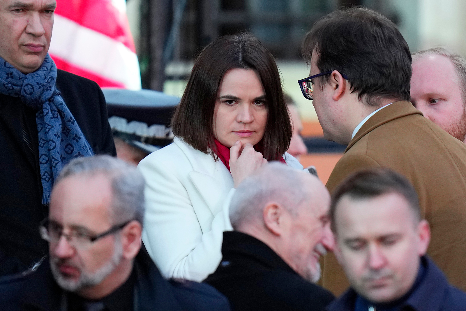 Belarusian opposition leader Sviatlana Tsikhanouskaya, center, waits for President Joe Biden to deliver a speech at the Royal Castle in Warsaw, Poland, Saturday, March 26.