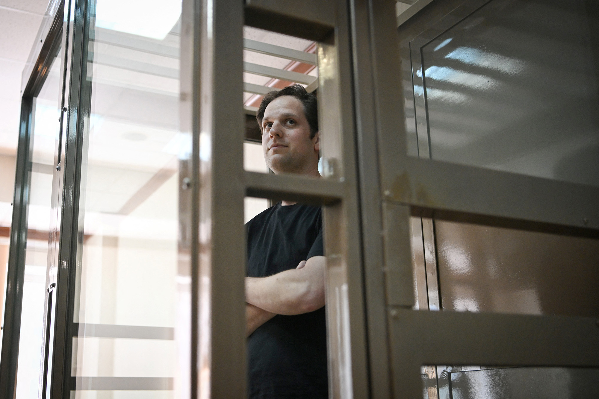 US journalist Evan Gershkovich stands inside a defendants' cage before a hearing to consider an appeal on his extended detention at The Moscow City Court in Moscow, Russia, on June 22.