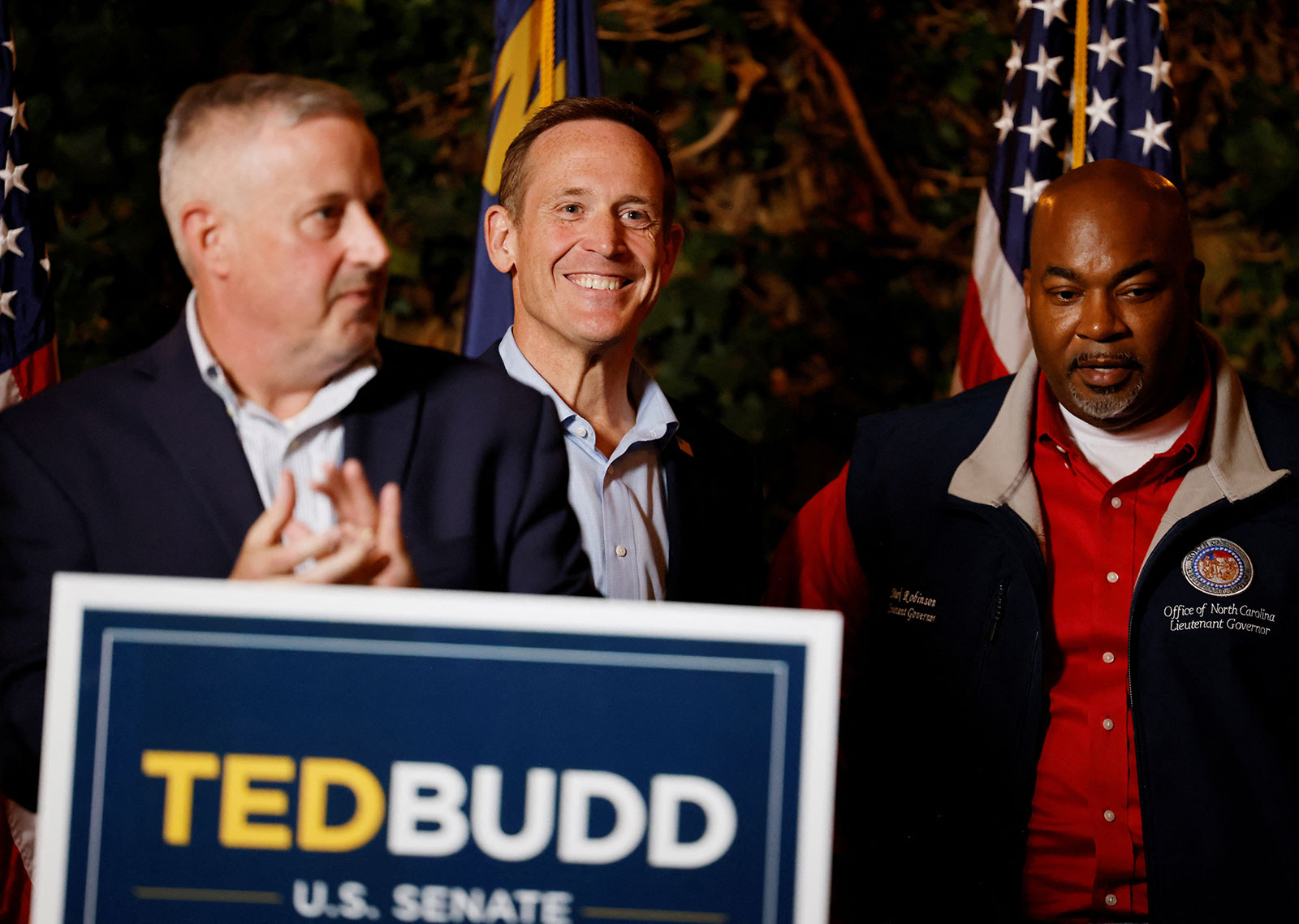 Rep. Ted Budd, flanked by the Republican state party chair Michael Whatley and North Carolina Lt. Gov. Mark Robinson, participate in a campaign event in Raleigh, North Carolina, on November 7. 