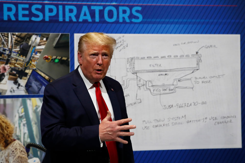 President Donald Trump speaks as he tours Ford's Rawsonville Components Plant that has been converted to making personal protection and medical equipment on Thursday, May 21, in Ypsilanti, Michigan.
