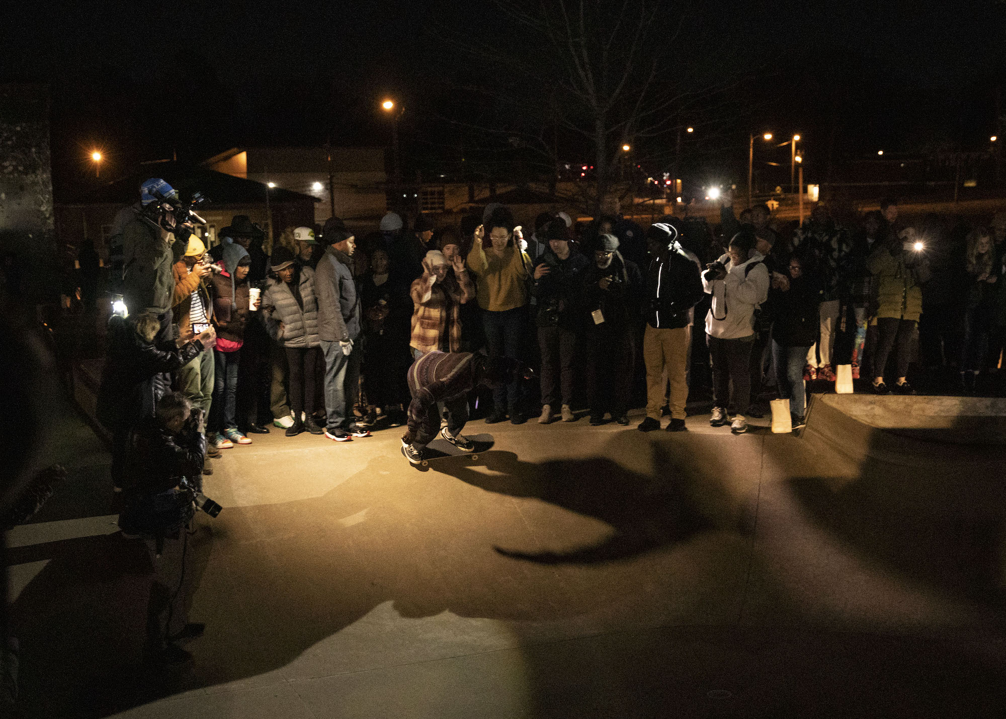 Local skaters ride at the candlelight vigil at Tobey Skatepark.