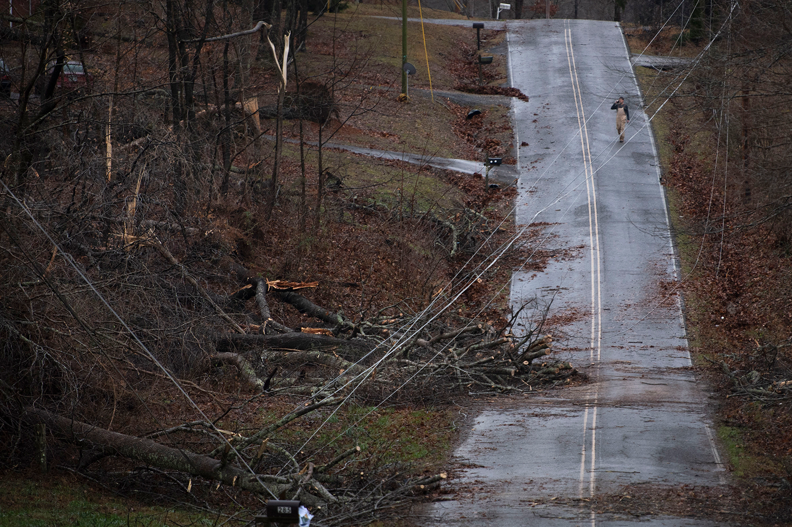 Murrell Rd. resident Keith Kruse surveys the damage from overnight storms that ripped through his community, Saturday, Dec. 11,  in Dickson Co., Tenn. (George Walker IV/The Tennessean/AP)