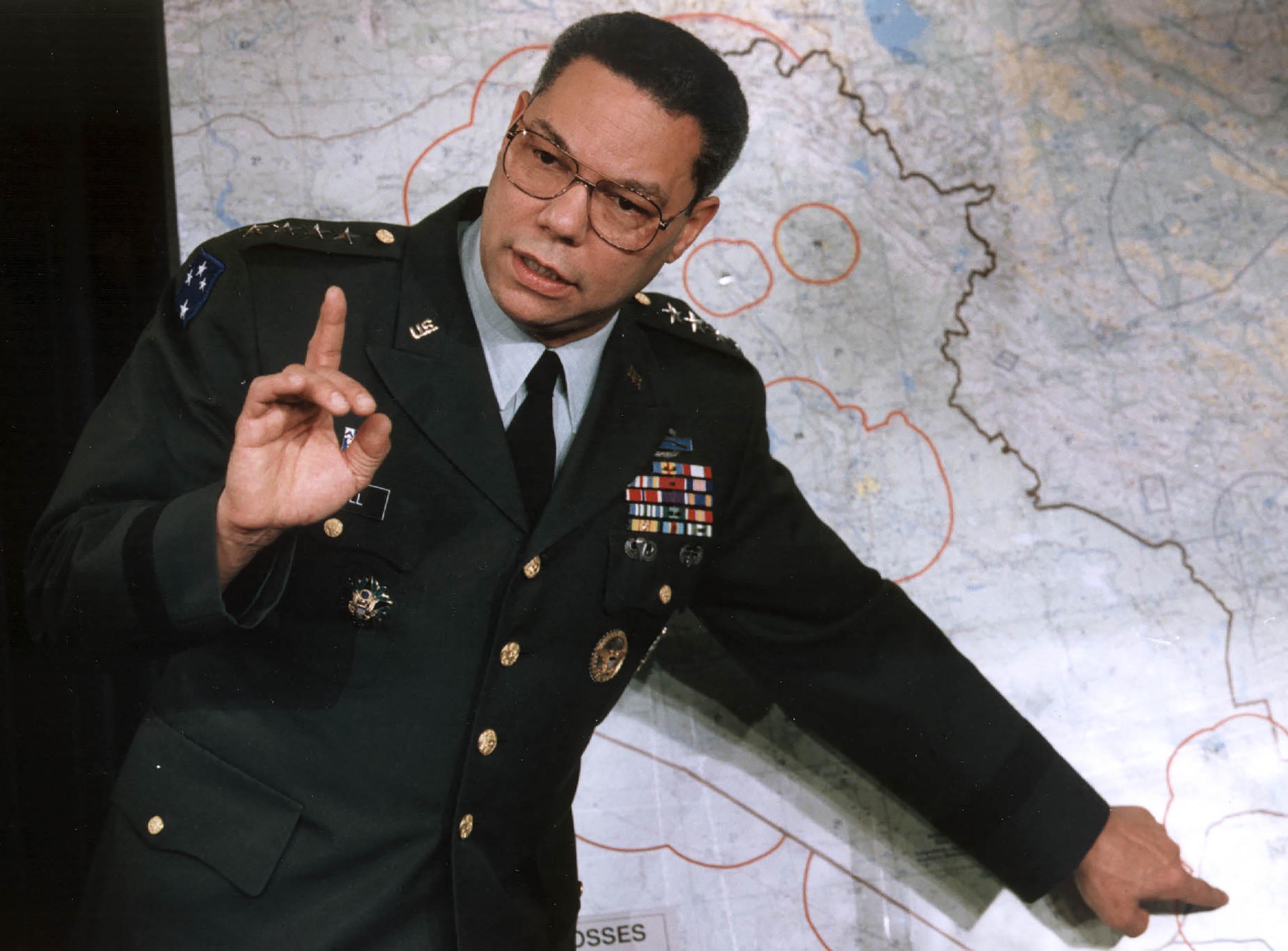 Colin Powell, chairman of the US Joint Chief of Staff, makes a point about the entrenched Iraqi troops in Kuwait during a briefing at the Pentagon in January 1991.